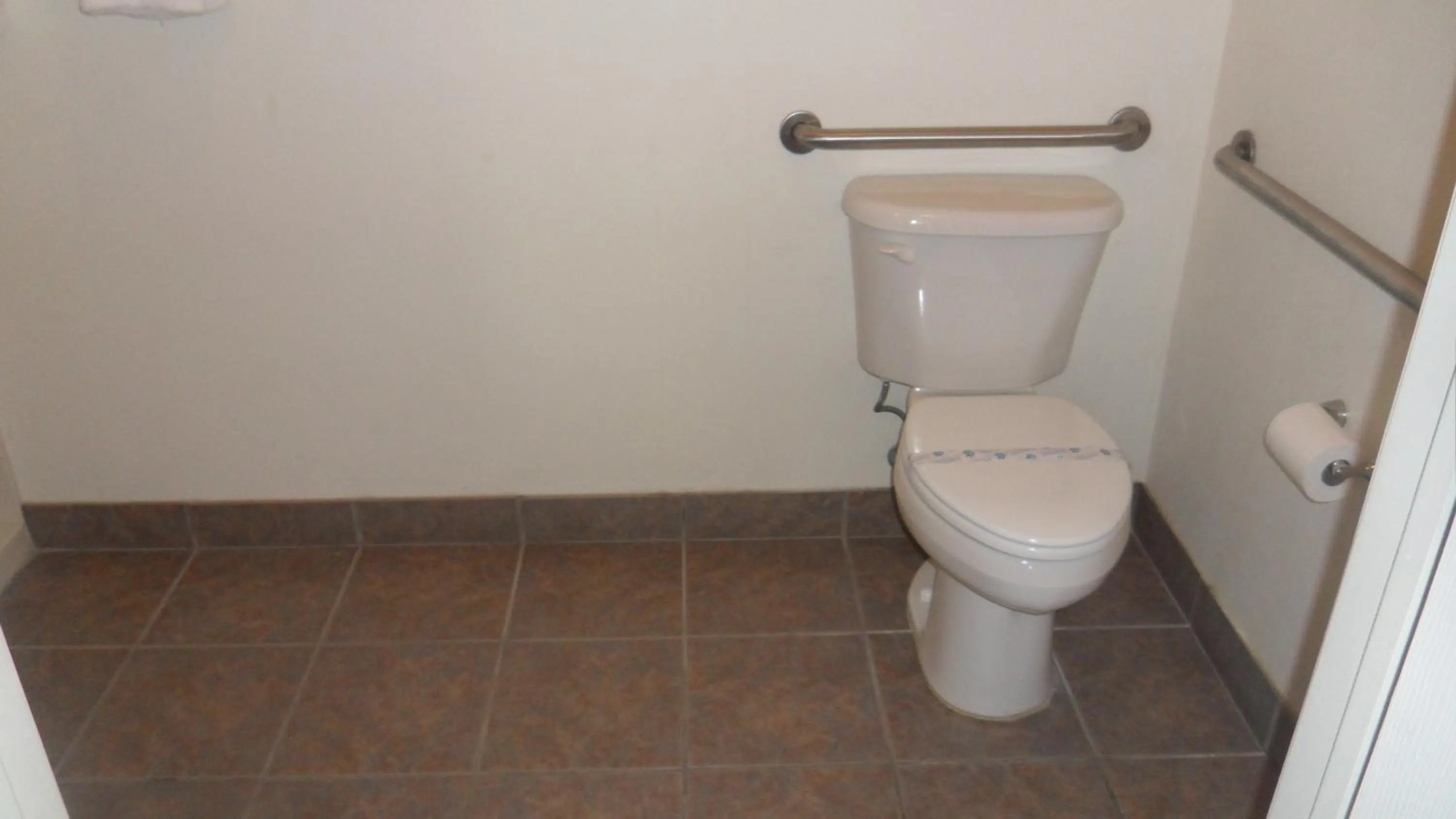 Toilet in Deluxe Inn Palacios