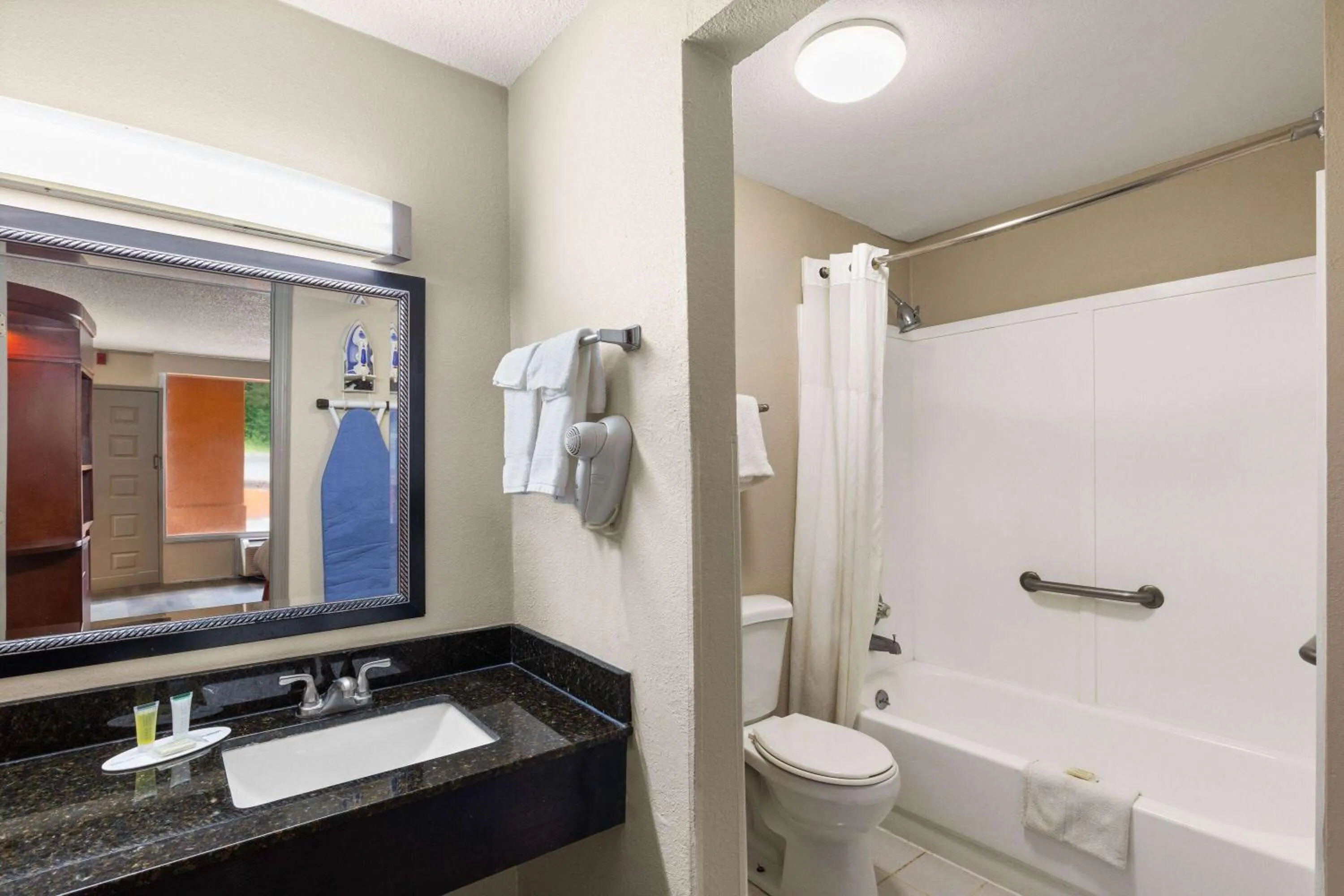 Bathroom in Days Inn by Wyndham Knoxville East