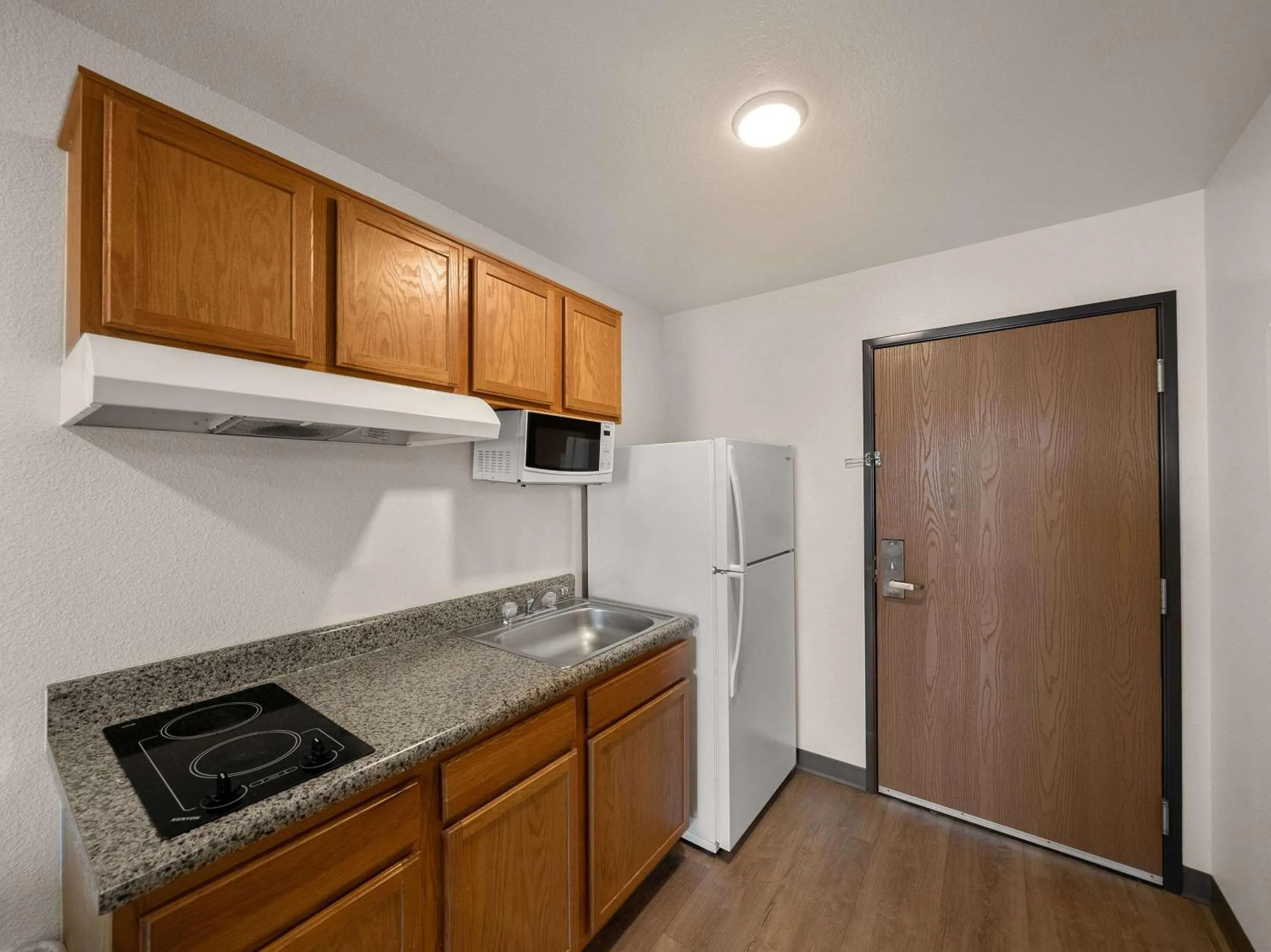 Bedroom in WoodSpring Suites Dallas Rockwall