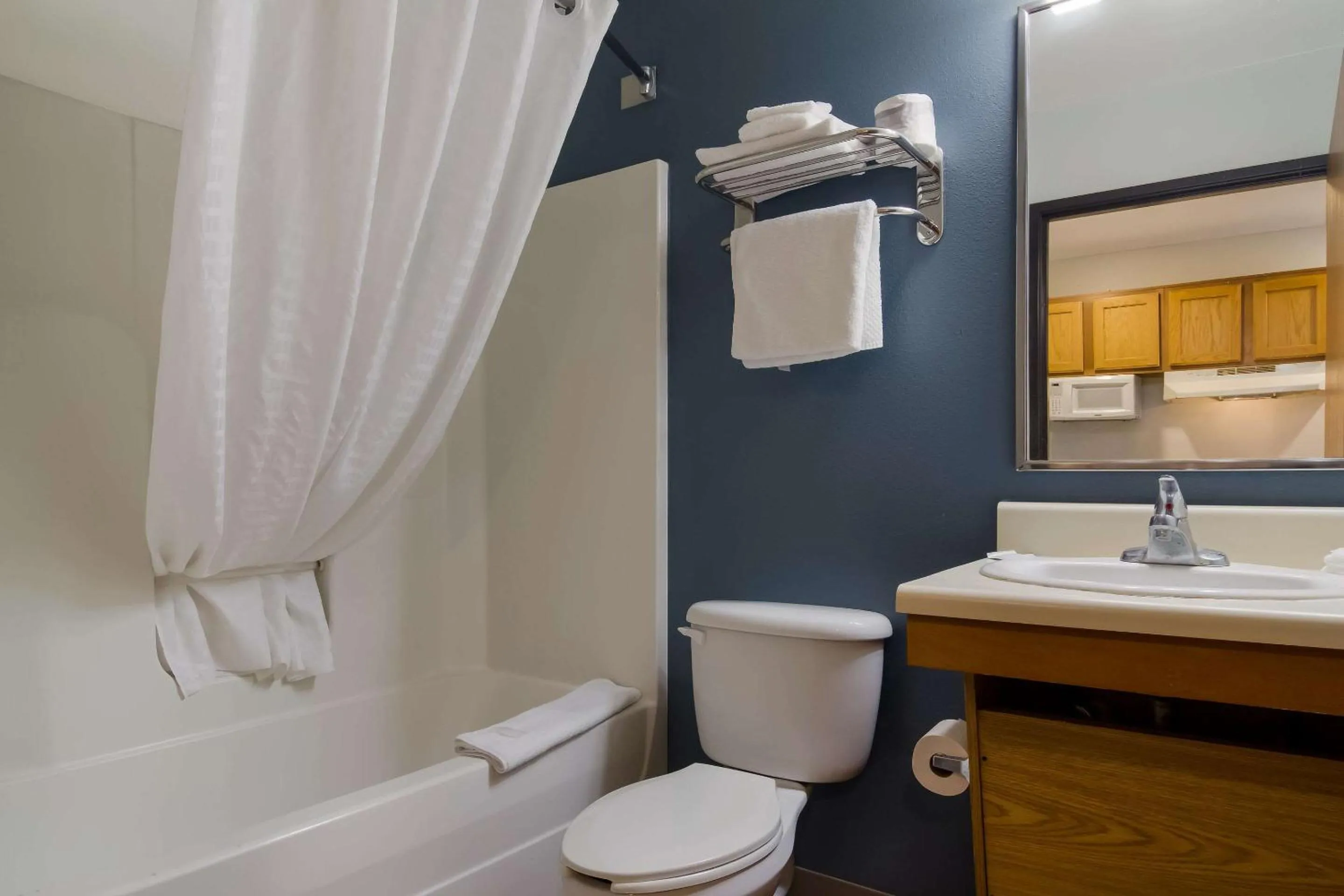 Bedroom in WoodSpring Suites Jacksonville I-295 East