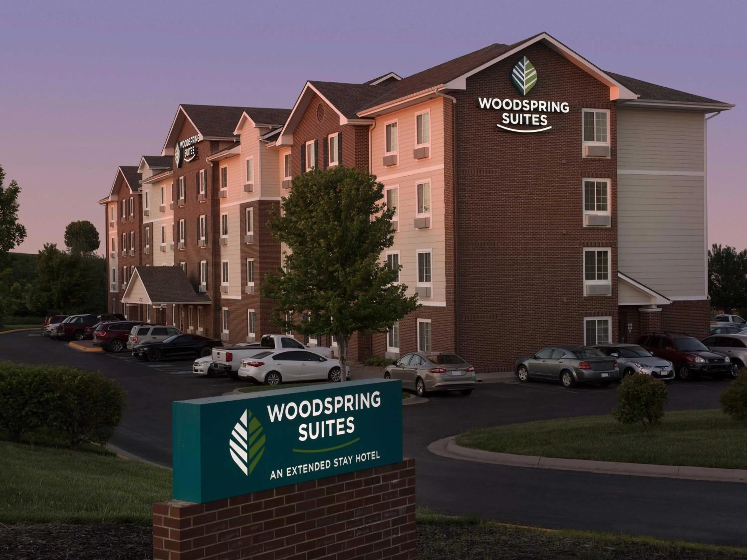 Property logo or sign in WoodSpring Suites Kansas City Lenexa