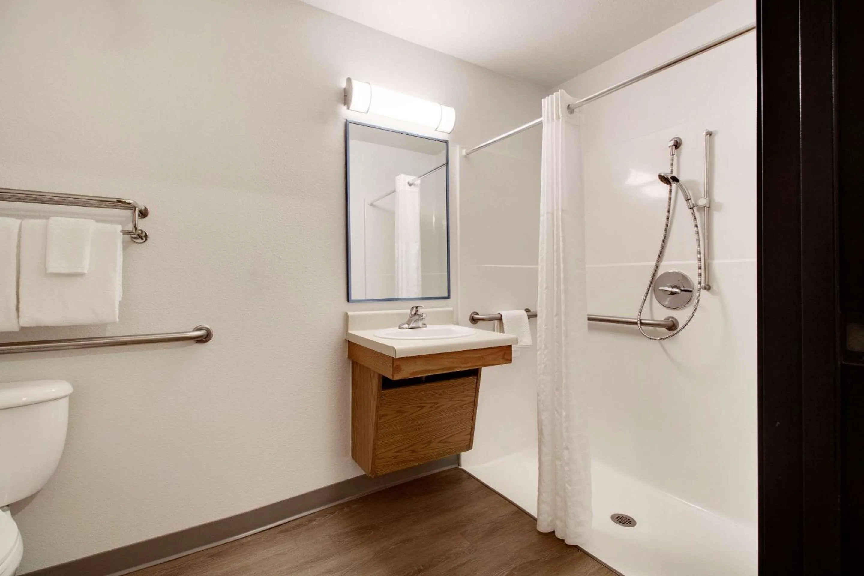 Bathroom in WoodSpring Suites Conroe