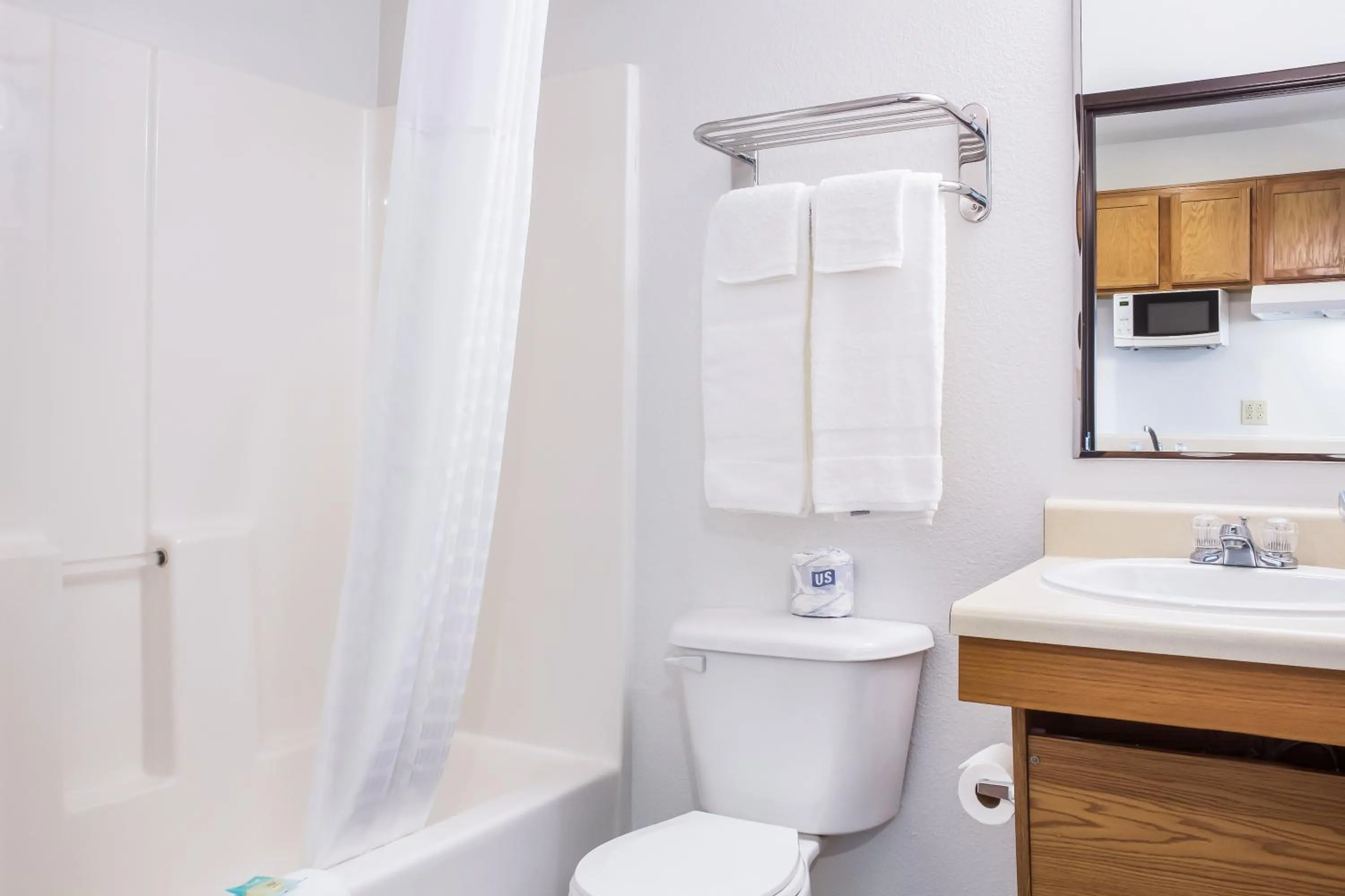 Bathroom in WoodSpring Suites Conroe