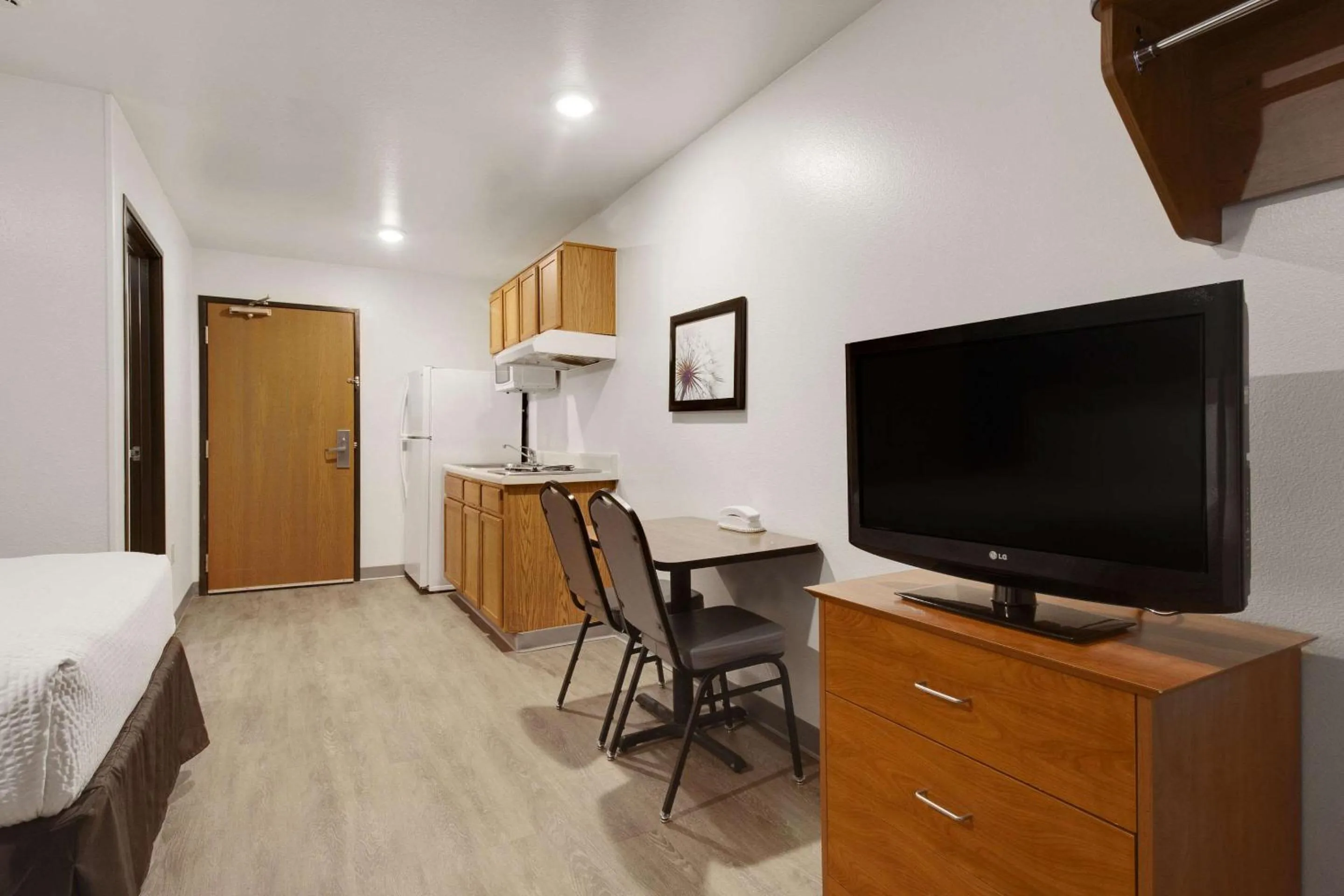 Bedroom, Bed in WoodSpring Suites Conroe