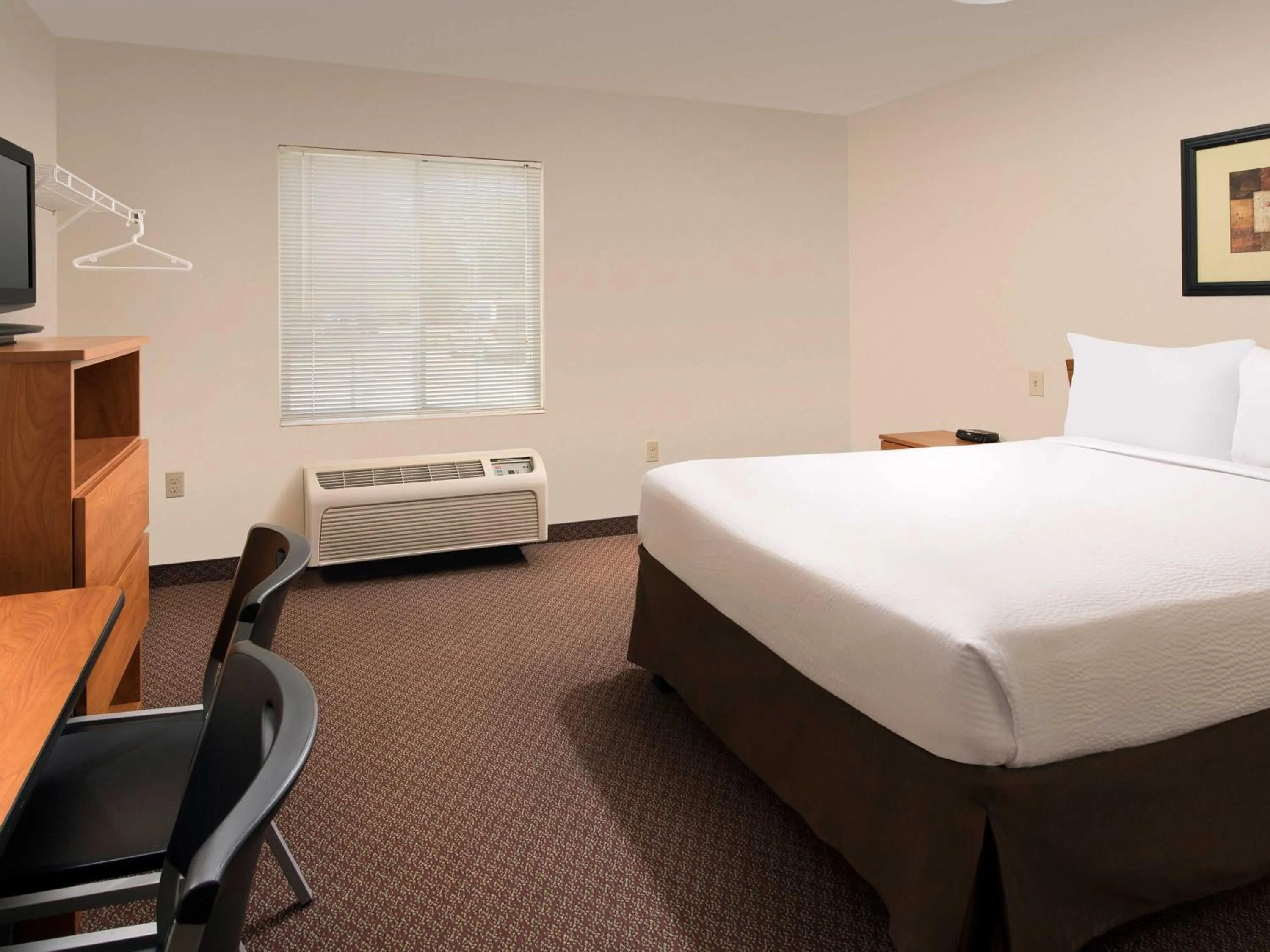 Bedroom, Bed in WoodSpring Suites Omaha Bellevue, an Extended Stay Hotel