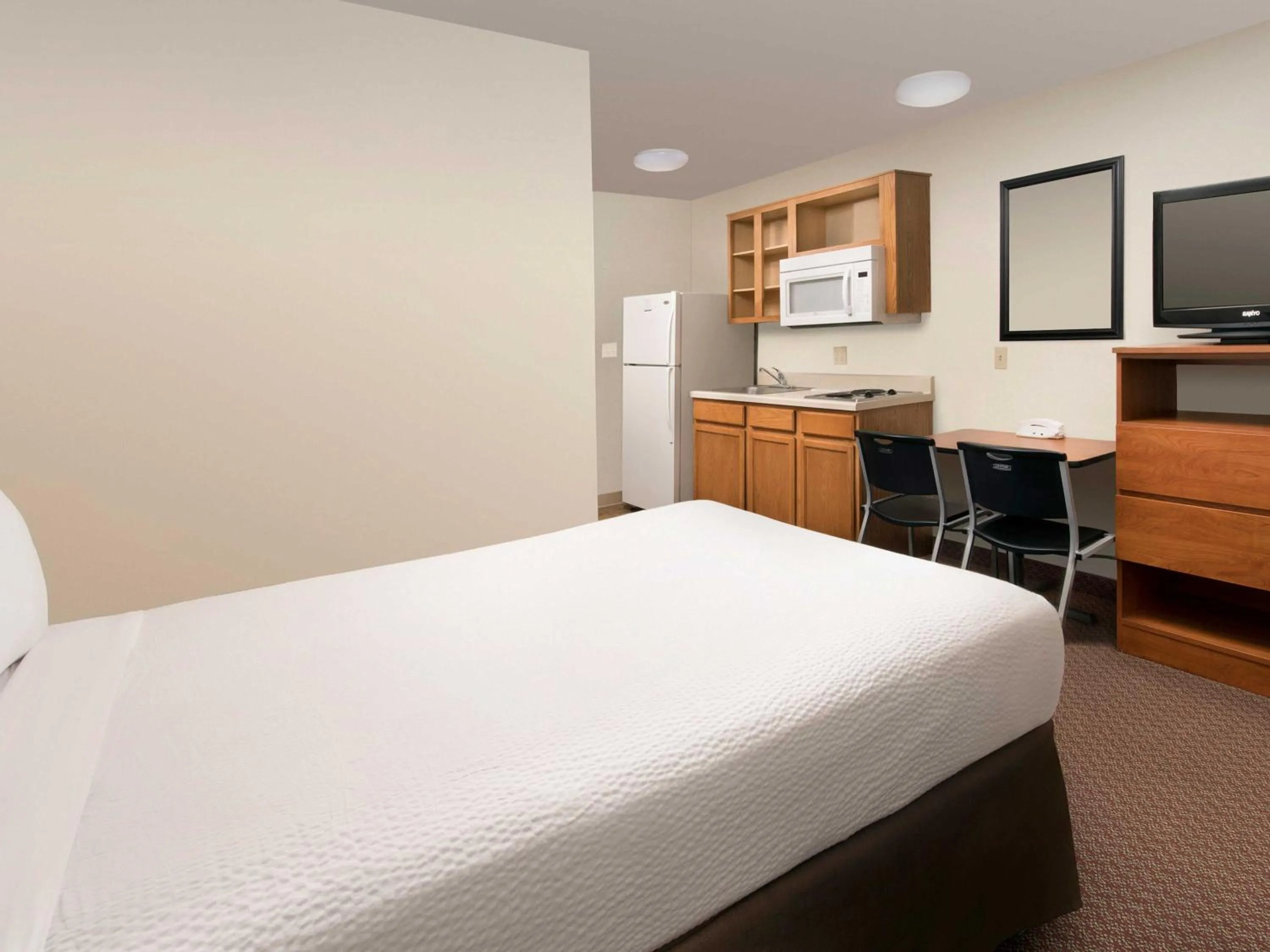 Photo of the whole room, Bed in WoodSpring Suites Omaha Bellevue, an Extended Stay Hotel