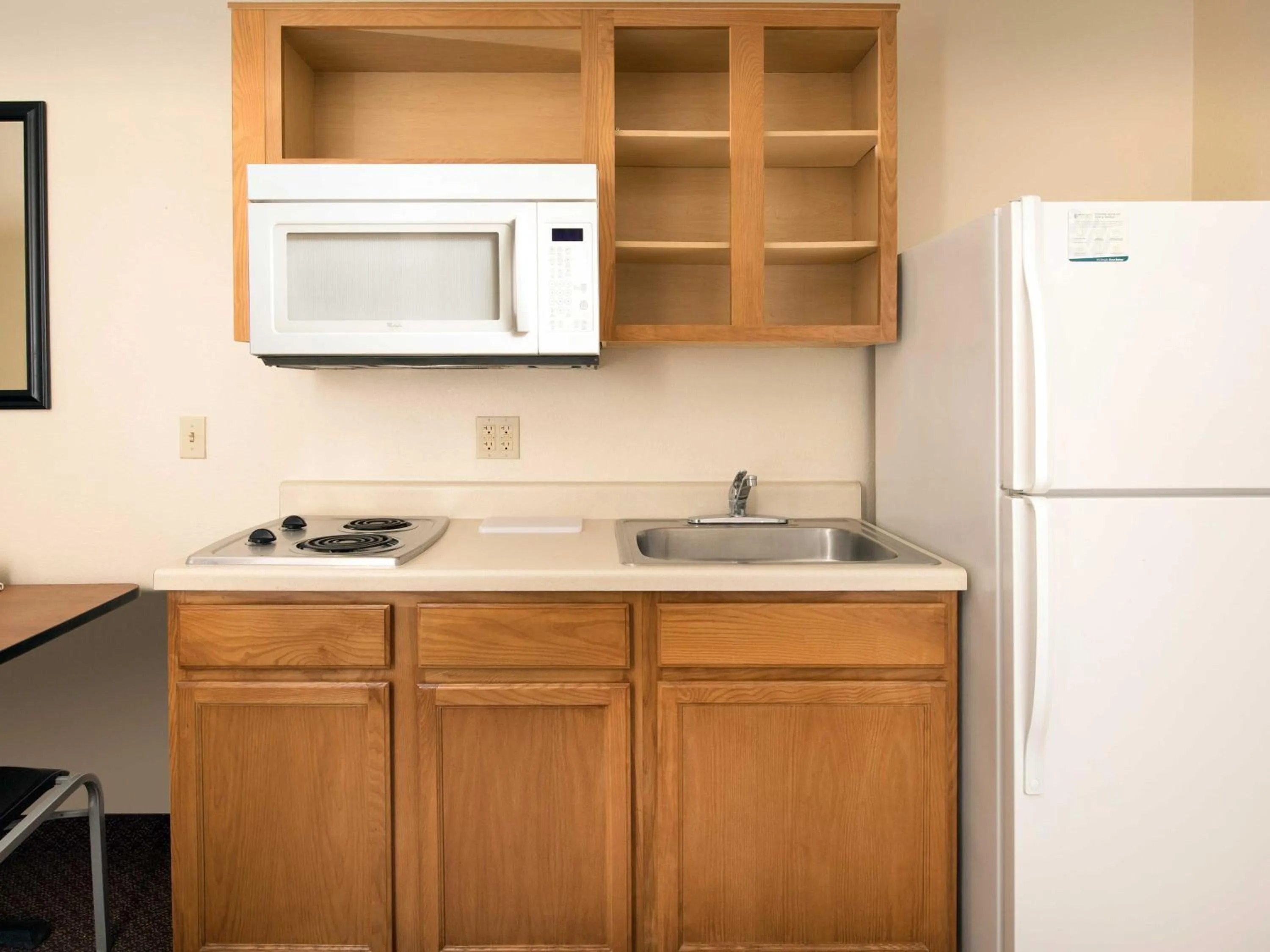 Kitchen or kitchenette in WoodSpring Suites Omaha Bellevue, an Extended Stay Hotel