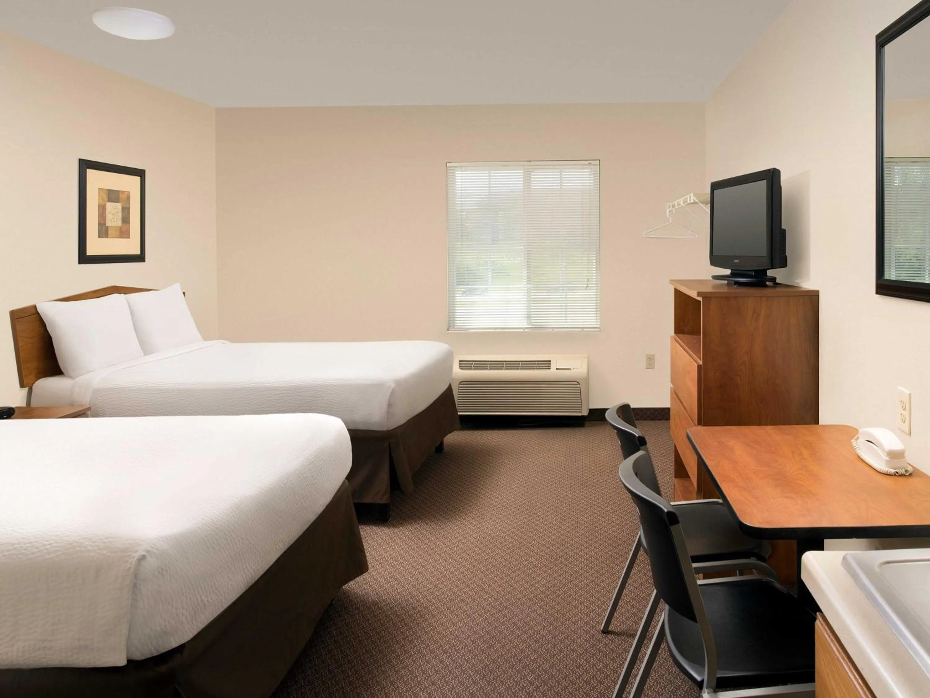 Photo of the whole room, Bed in WoodSpring Suites Omaha Bellevue, an Extended Stay Hotel