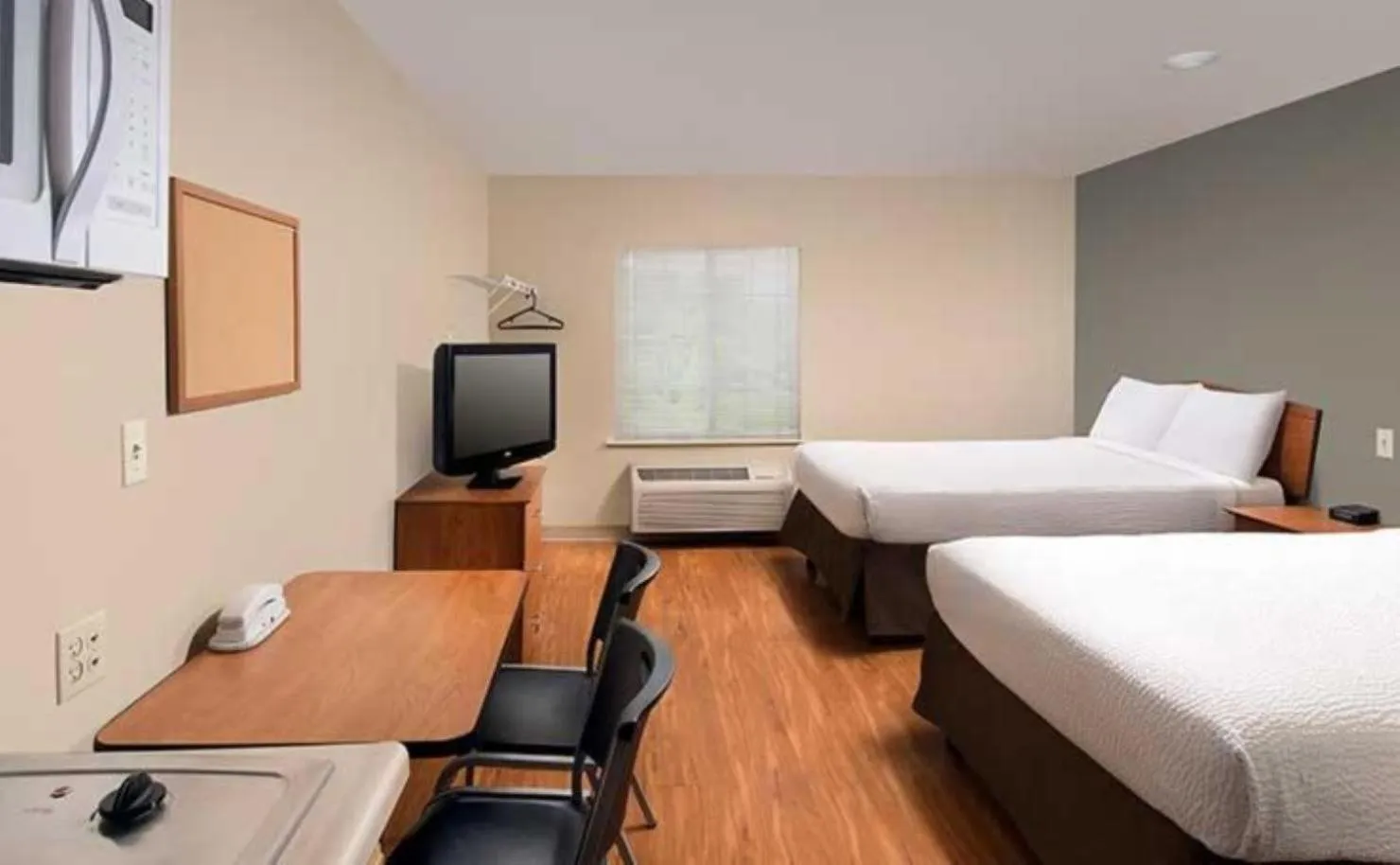 Photo of the whole room, Bed in WoodSpring Suites Council Bluffs