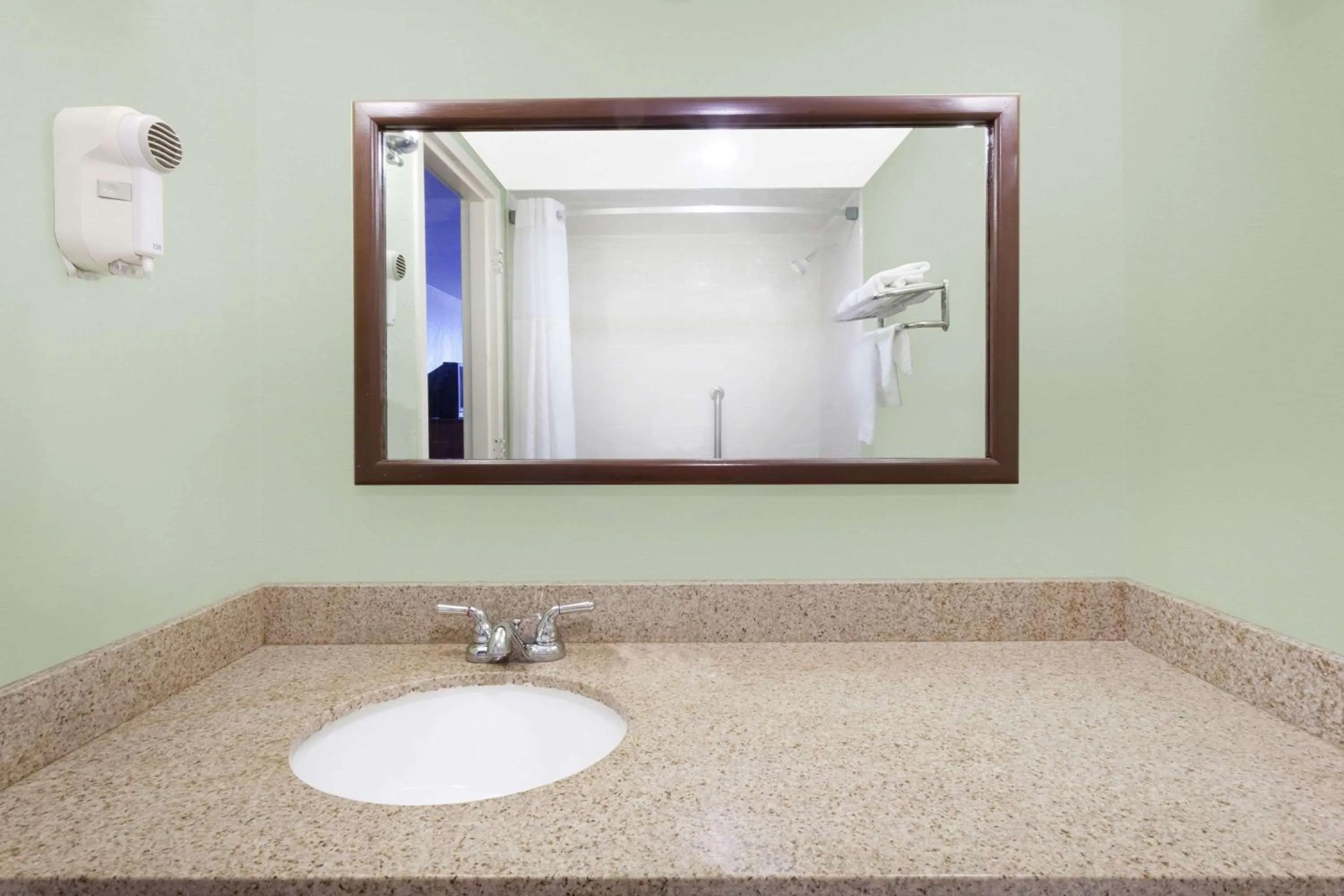 Bathroom in Days Inn & Suites by Wyndham SE Columbia Ft Jackson