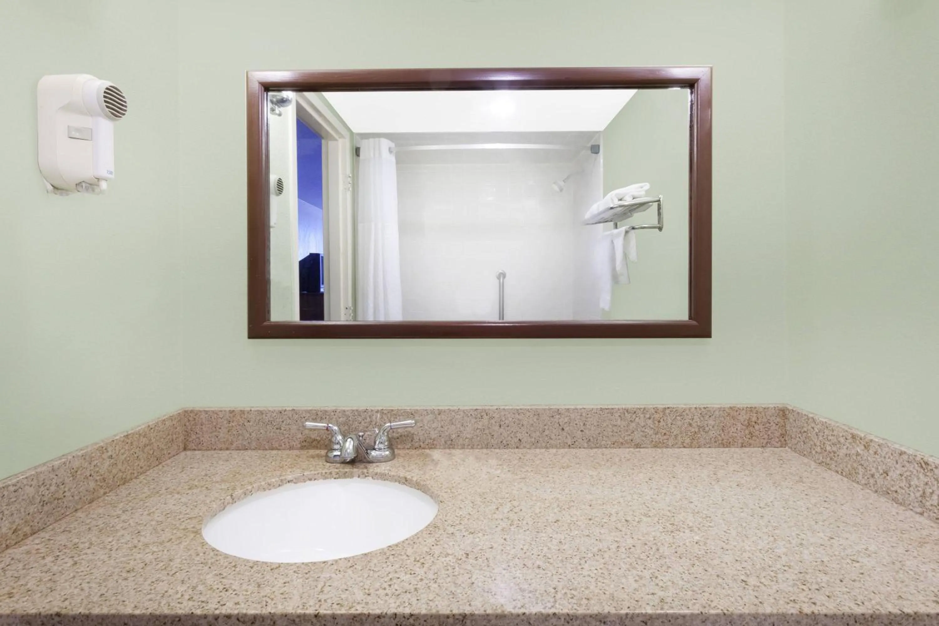 Bathroom in Days Inn & Suites by Wyndham SE Columbia Ft Jackson