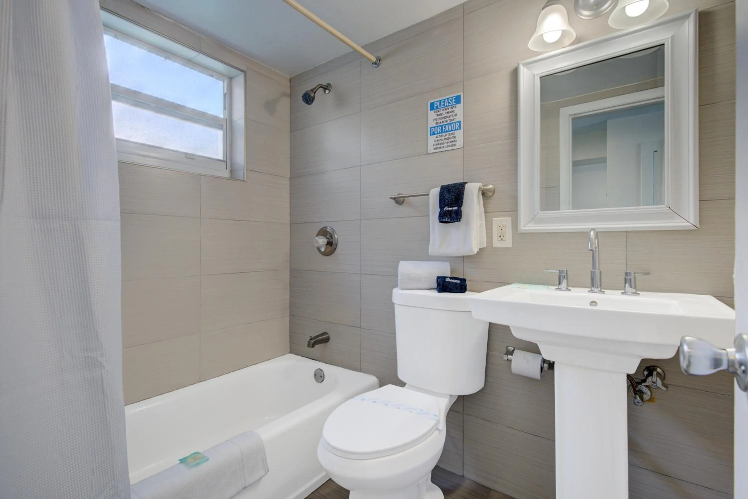 Bathroom in Leeward Motel By Capital O North Miami Beachside