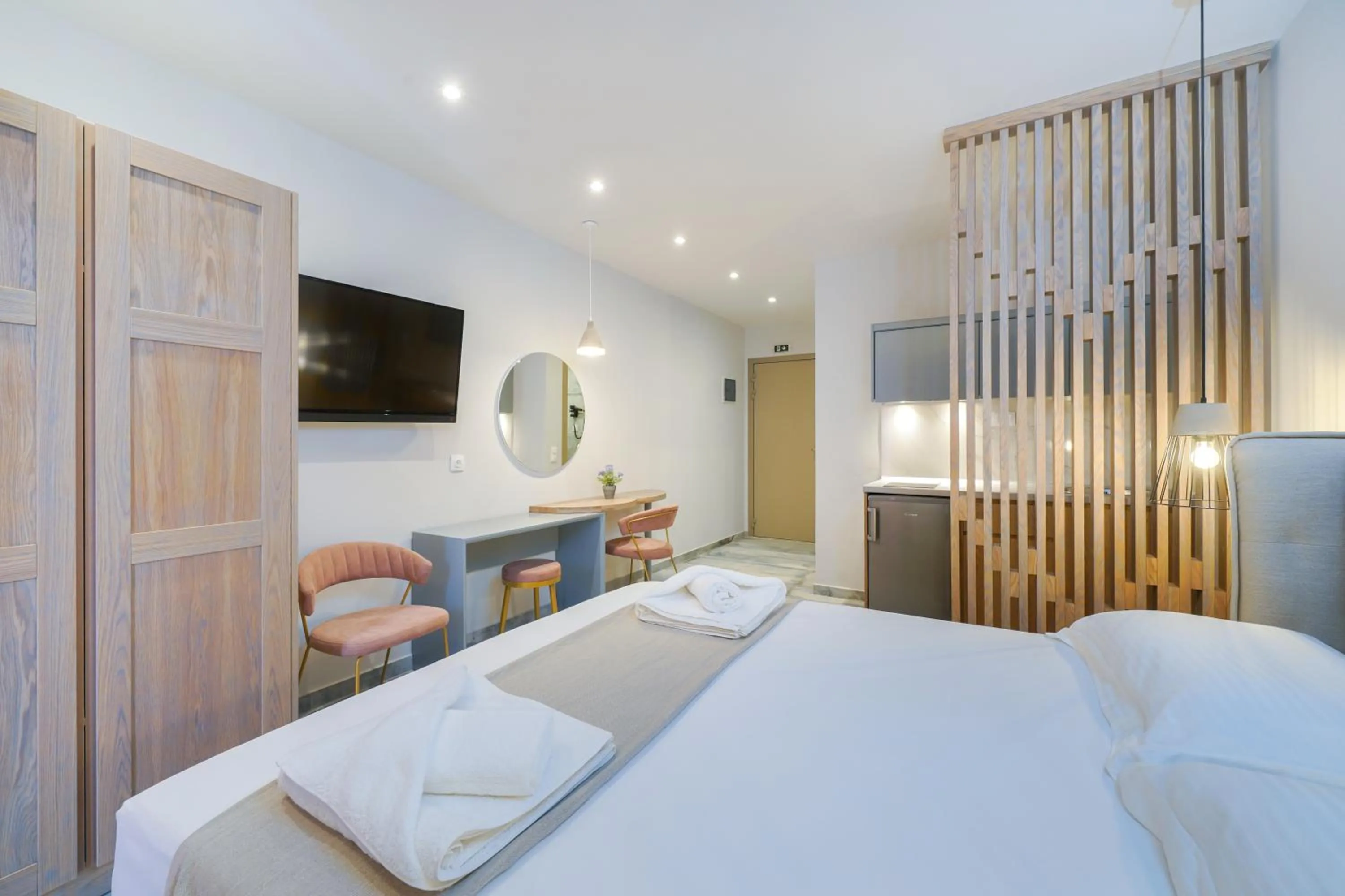 Photo of the whole room, Bed in Iliomagic Luxury Suites Thassos