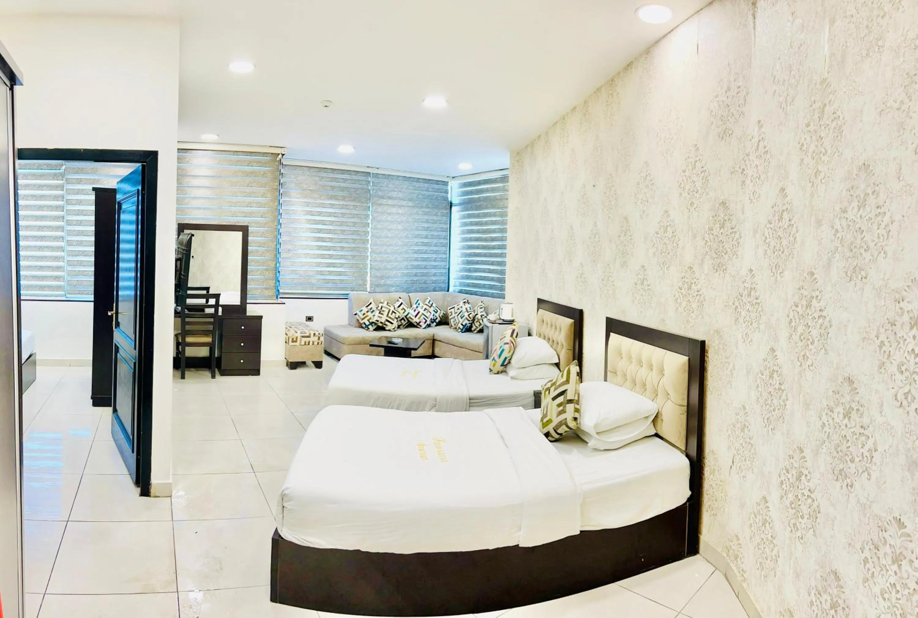 Bed in Panorama Amman Hotel