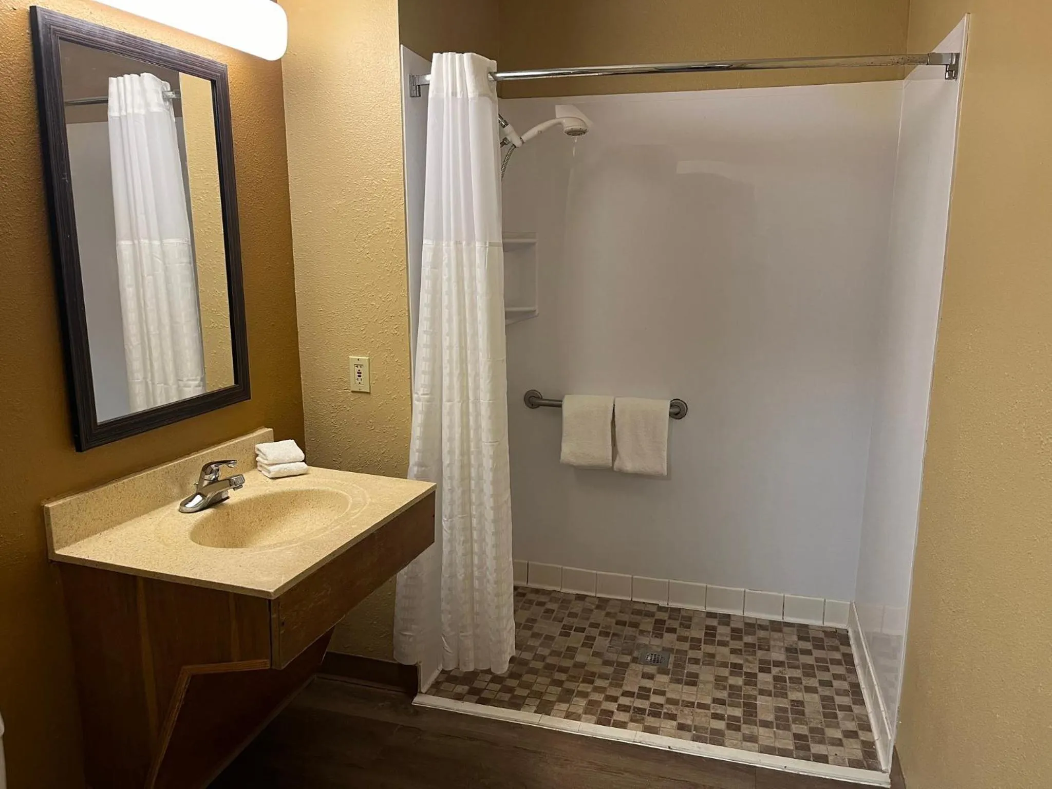Bathroom in HomeTowne Studios & Suites by Red Roof Greensboro