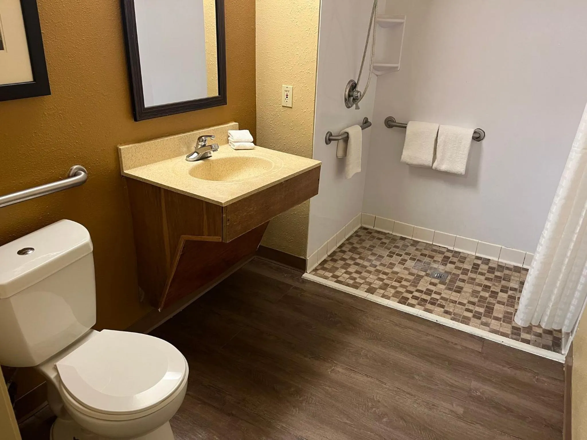 Bathroom in HomeTowne Studios & Suites by Red Roof Greensboro