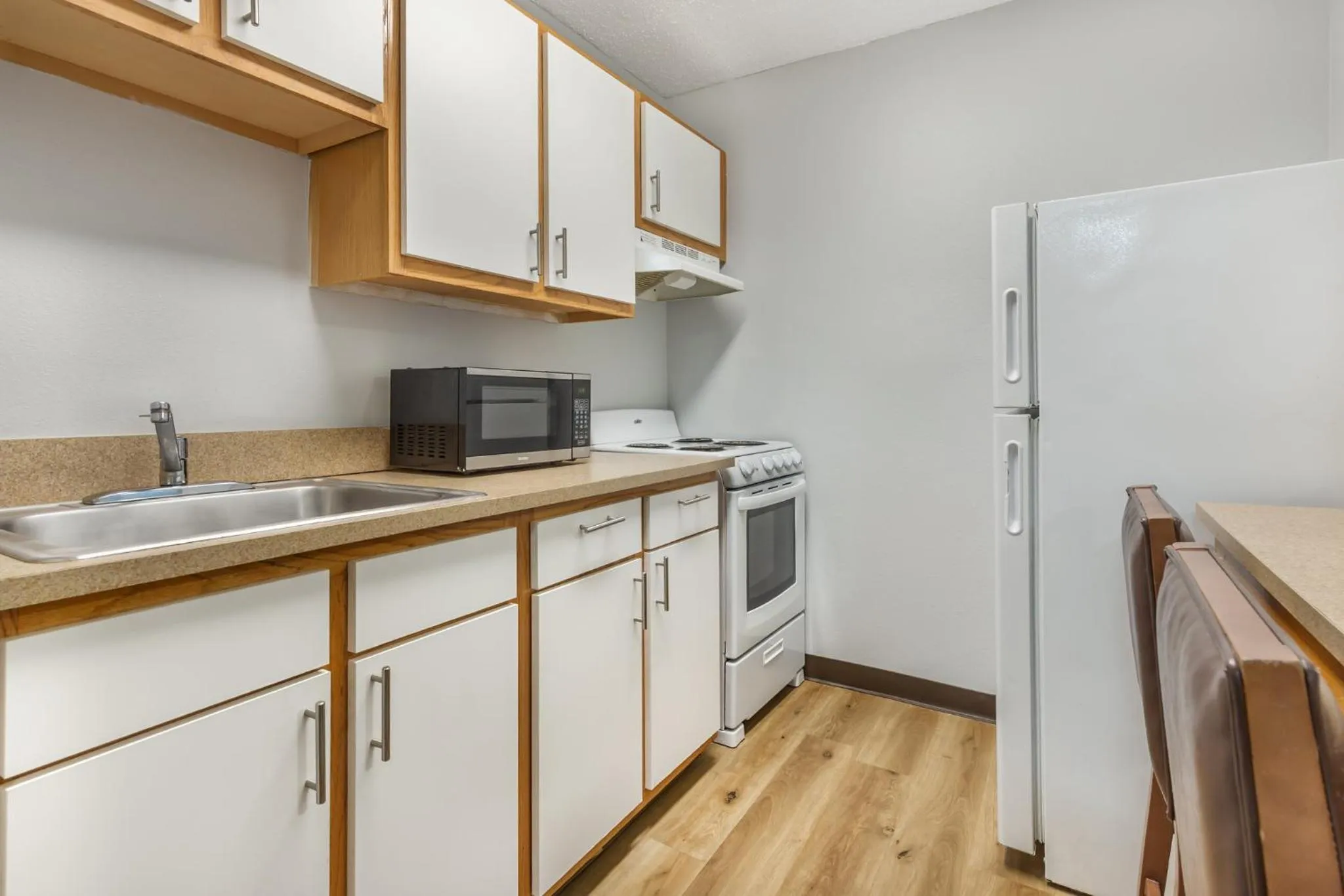 Kitchen or kitchenette in HomeTowne Studios & Suites by Red Roof Greensboro
