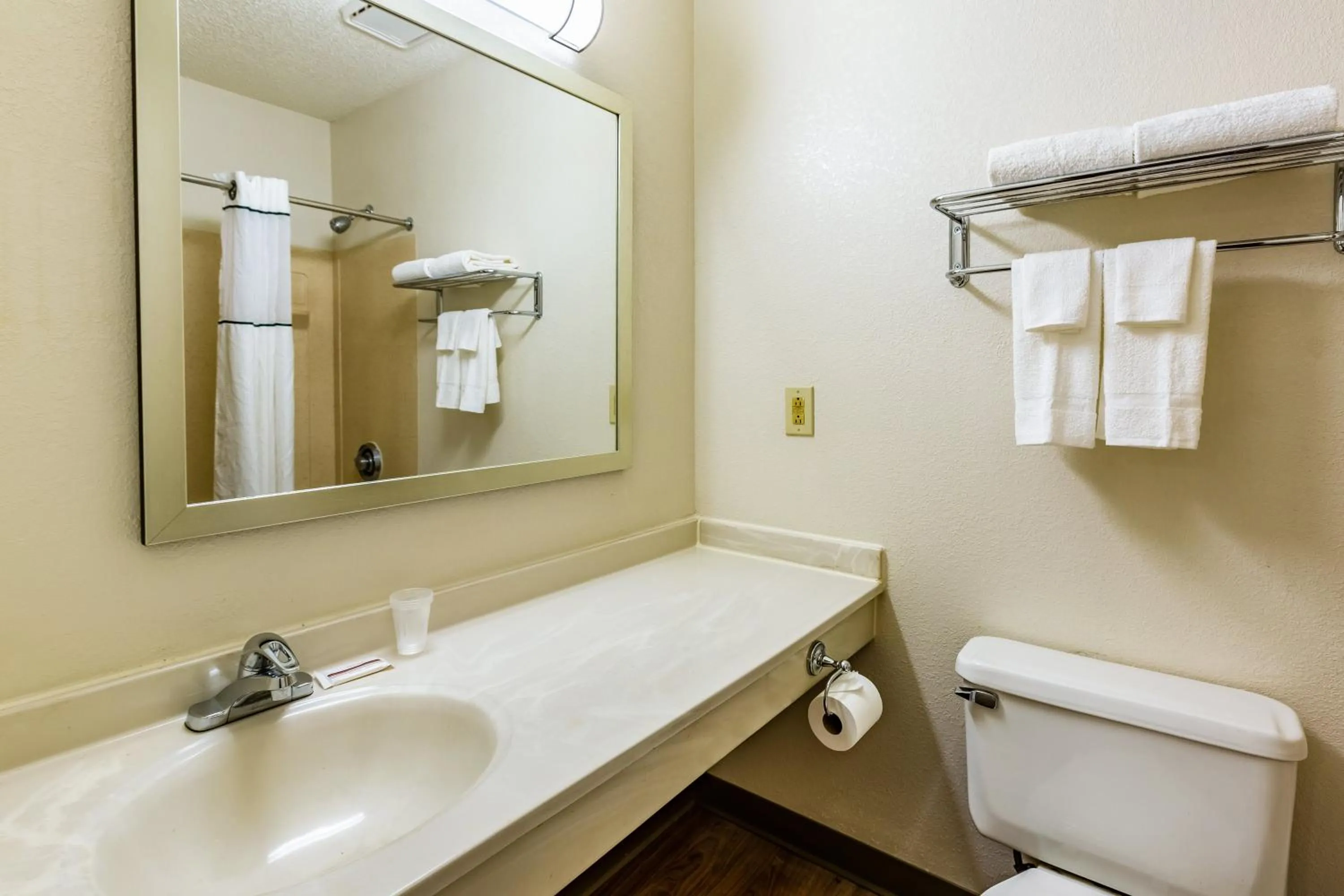 Bathroom in HomeTowne Studios by Red Roof Atlanta NE - Downtown Norcross