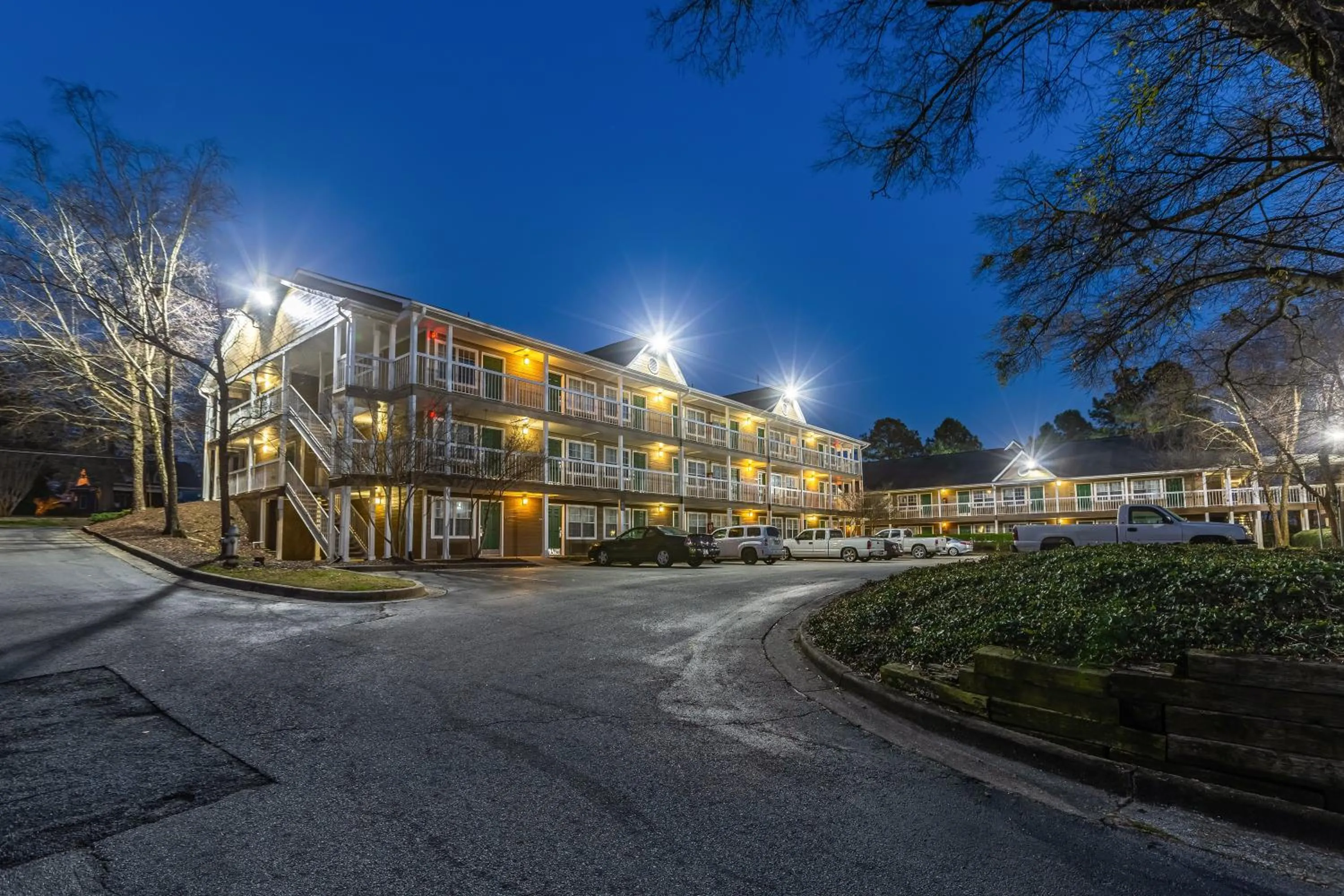 Property building in HomeTowne Studios by Red Roof Atlanta NE - Downtown Norcross