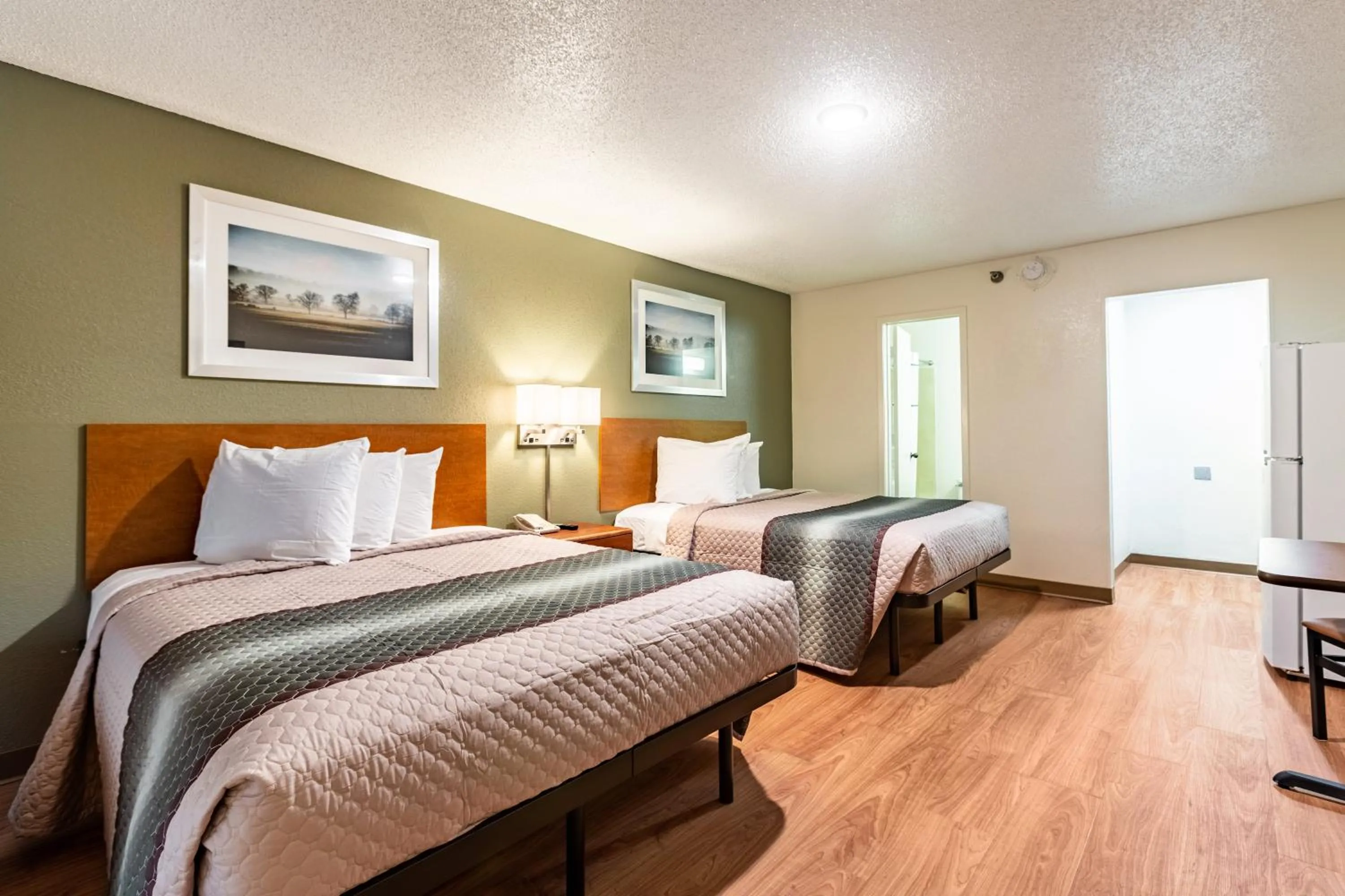 Photo of the whole room, Bed in HomeTowne Studios by Red Roof Atlanta NE - Downtown Norcross