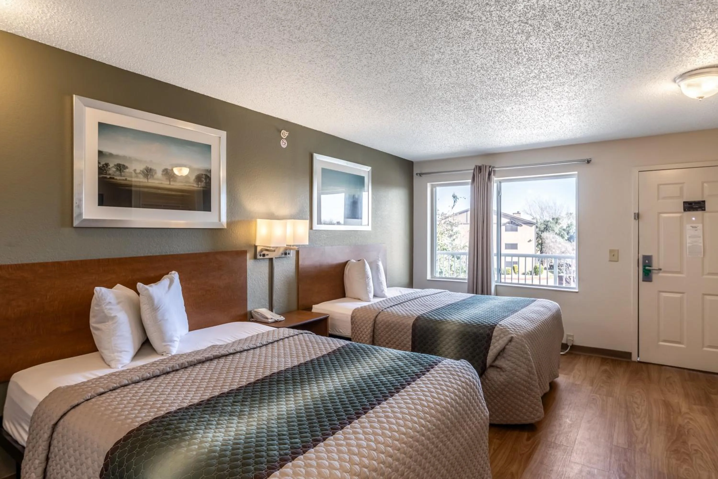 Photo of the whole room, Bed in HomeTowne Studios by Red Roof Austin