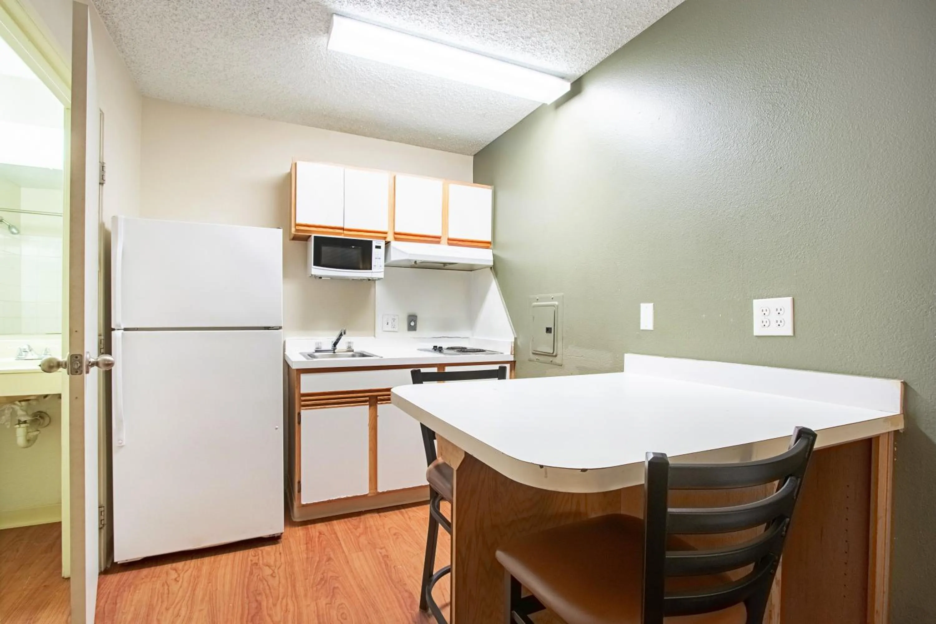 Photo of the whole room in HomeTowne Studios by Red Roof Phoenix - Dunlap Ave