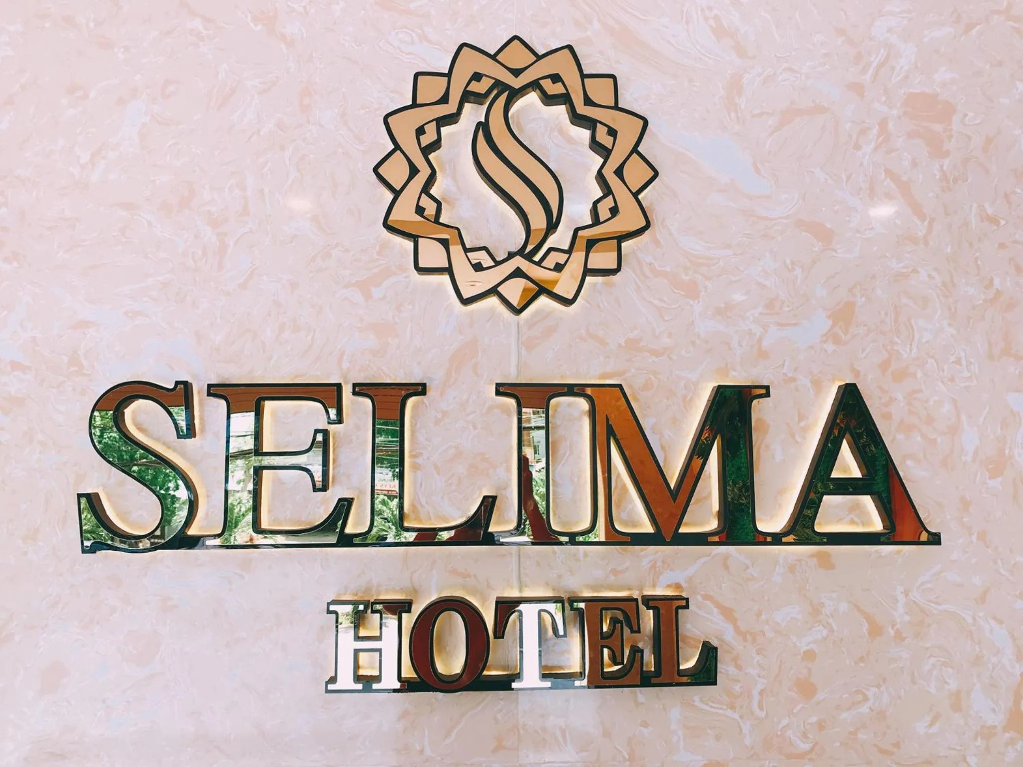 Property logo or sign in Selima Hotel