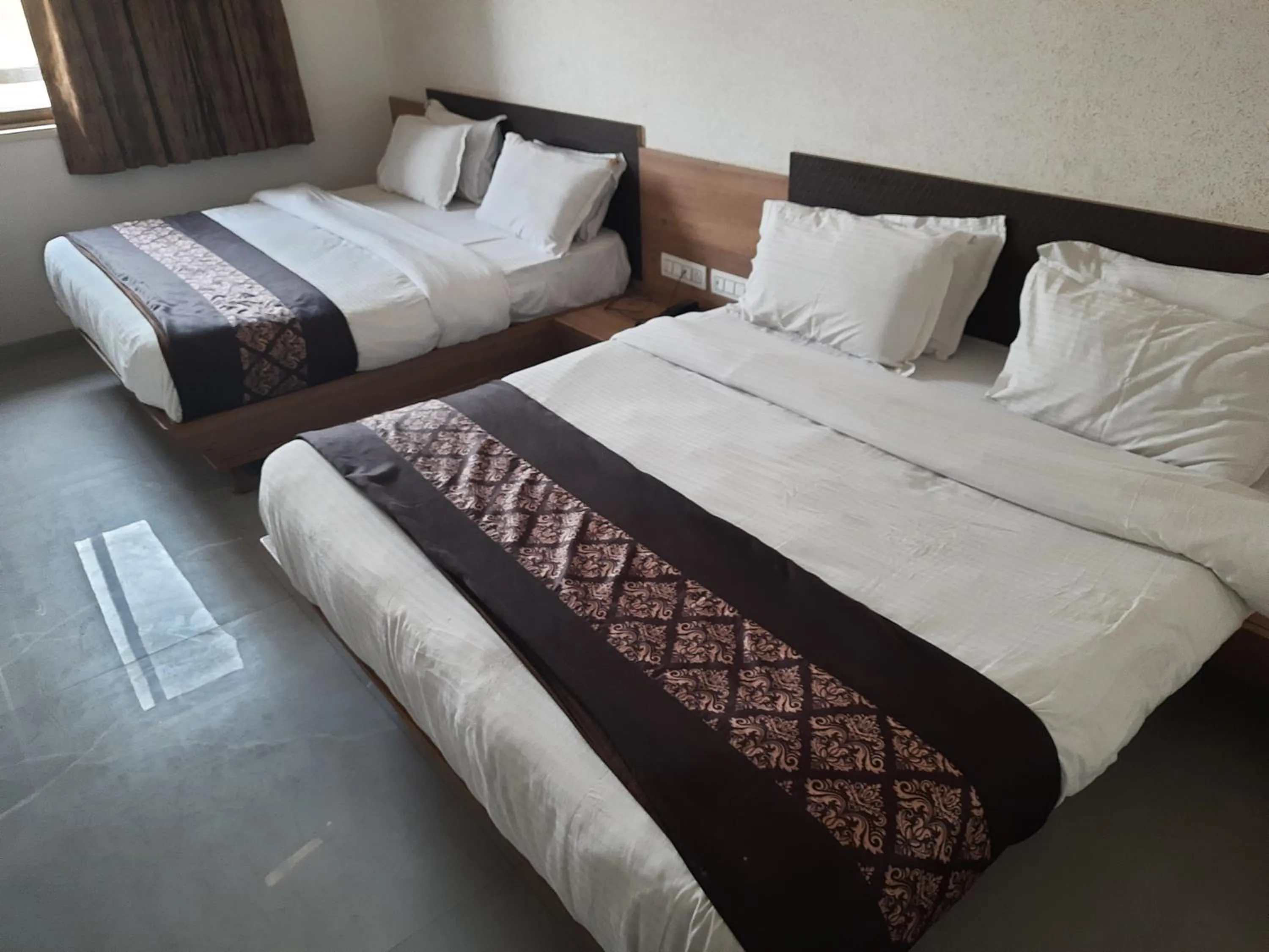 Bed in Meridian Hotel & Banquet