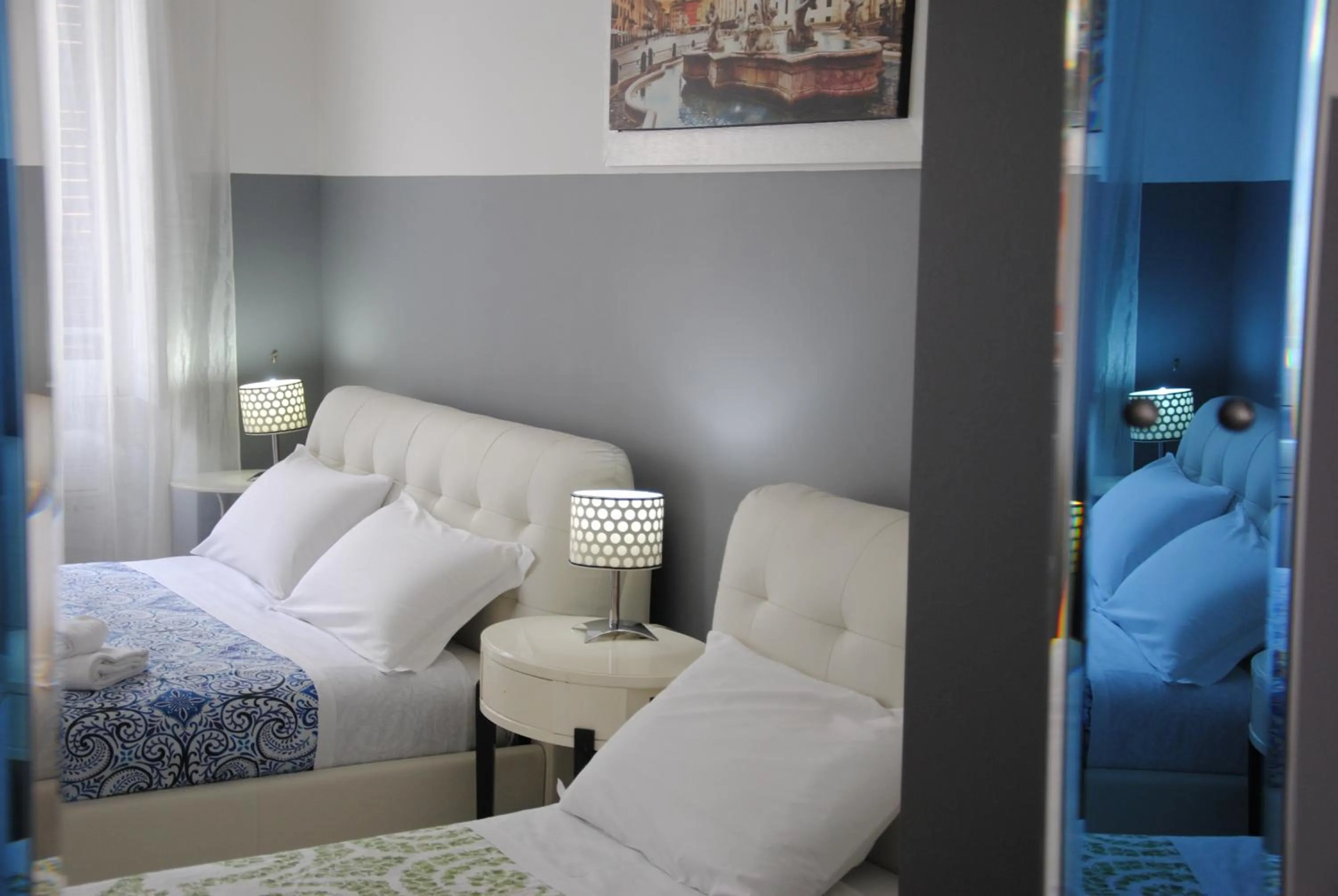 Photo of the whole room, Bed in Vatican Room and Kitchen