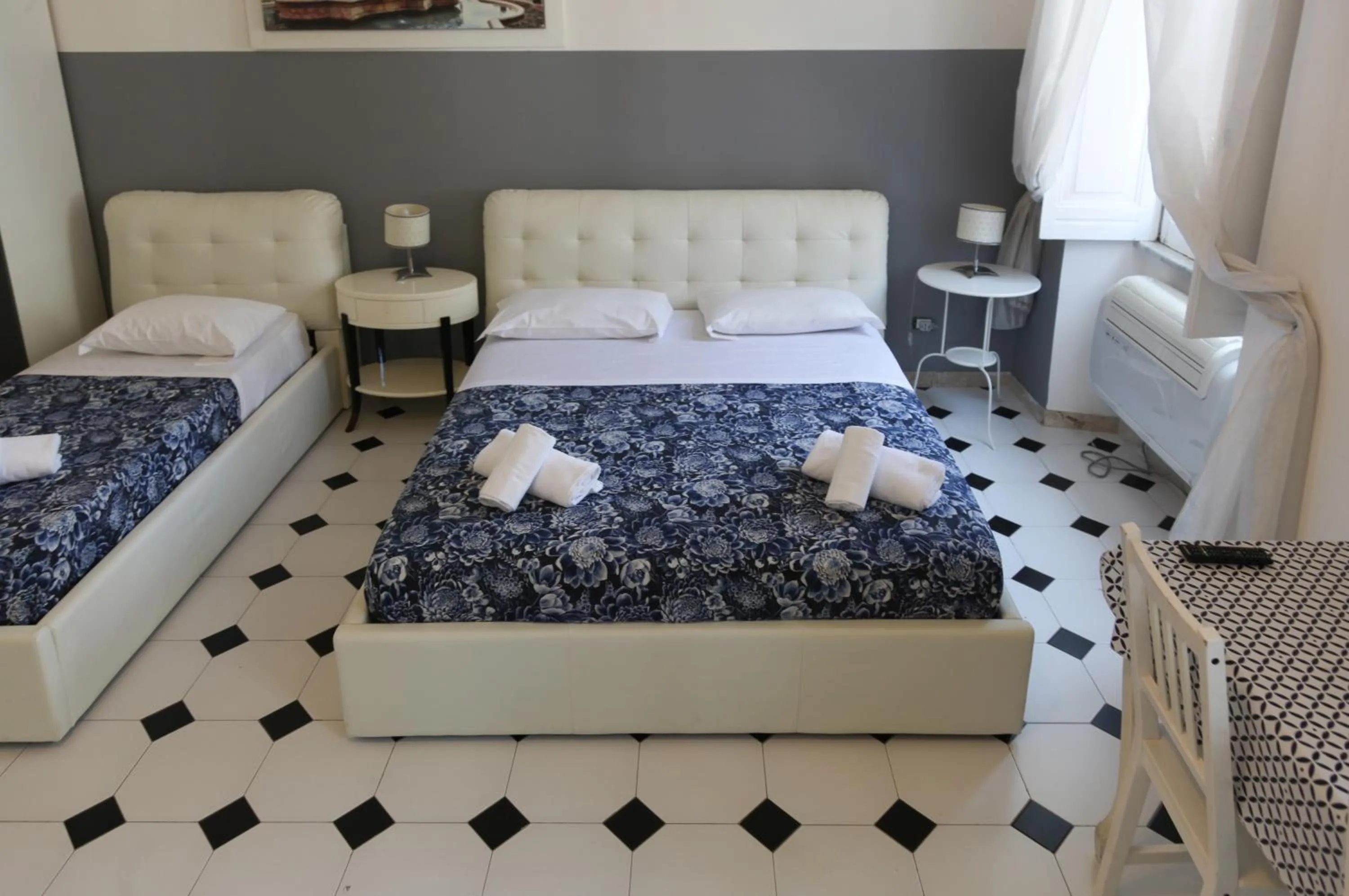 Photo of the whole room, Bed in Vatican Room and Kitchen