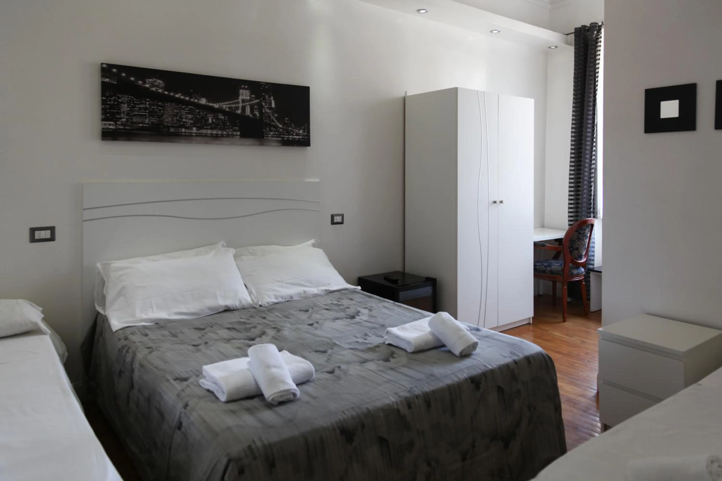 Photo of the whole room, Bed in Vatican Room and Kitchen