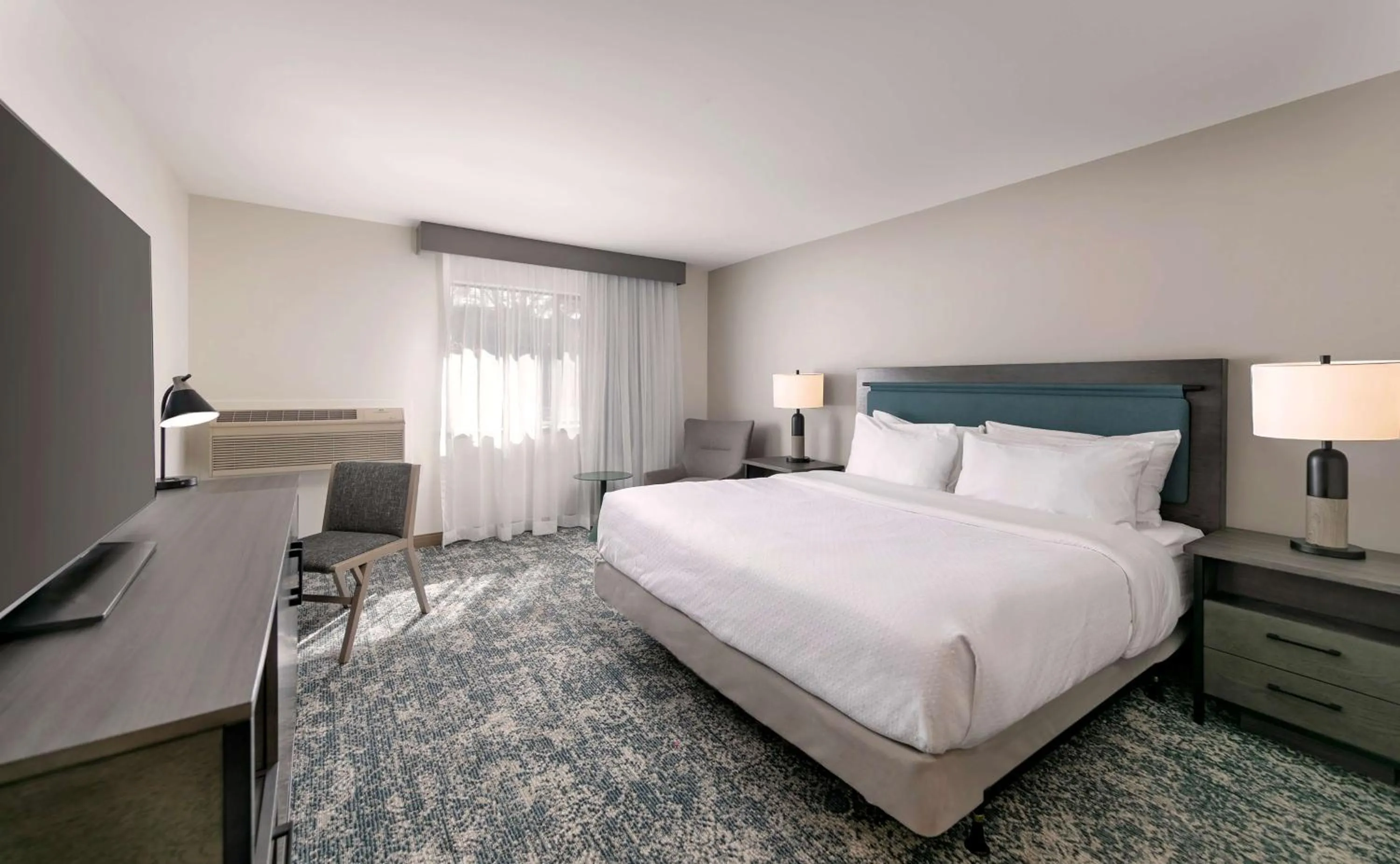 Bed in Seacliff Inn Aptos, Tapestry Collection by Hilton