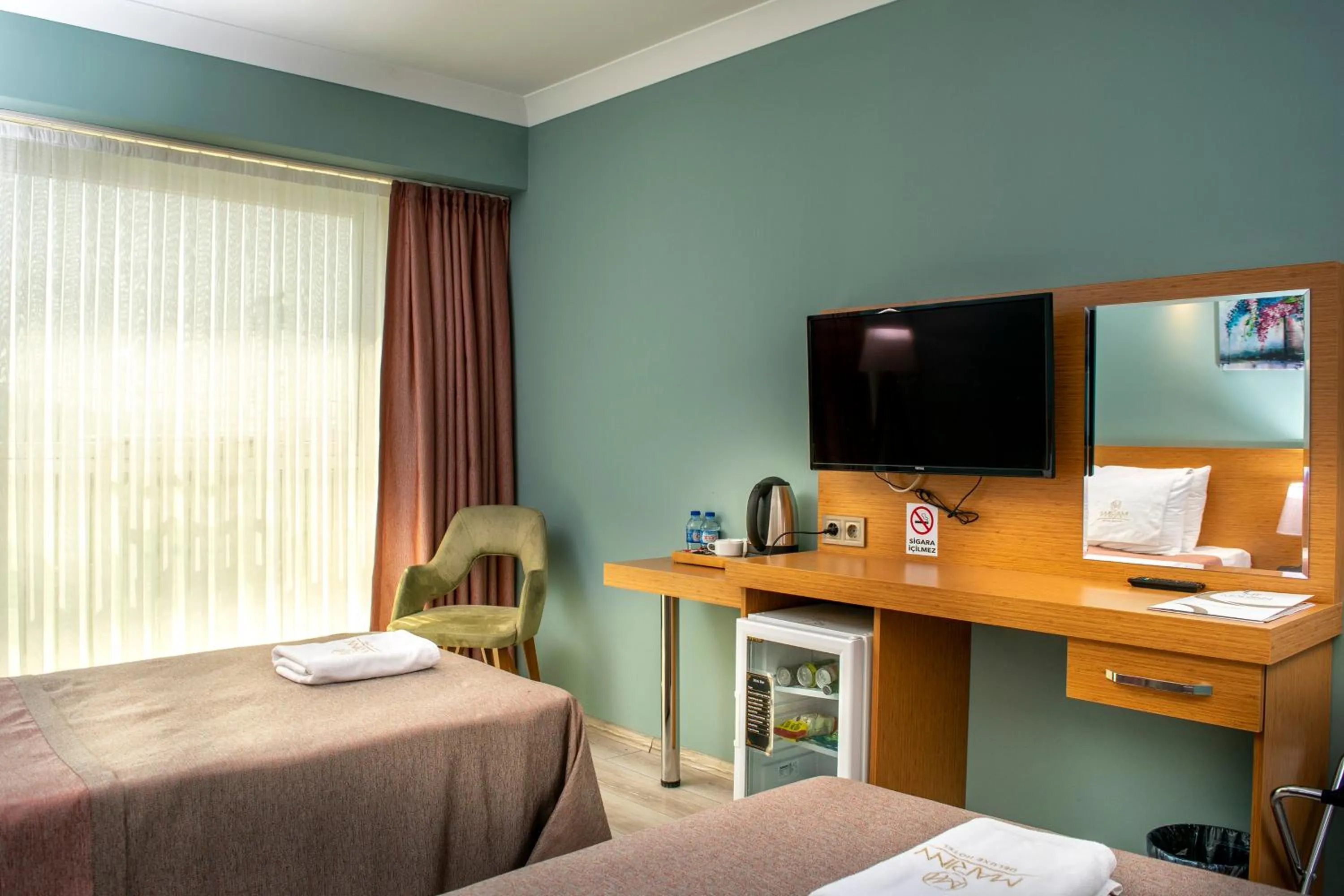 Bed in MARINN DELUXE HOTEL