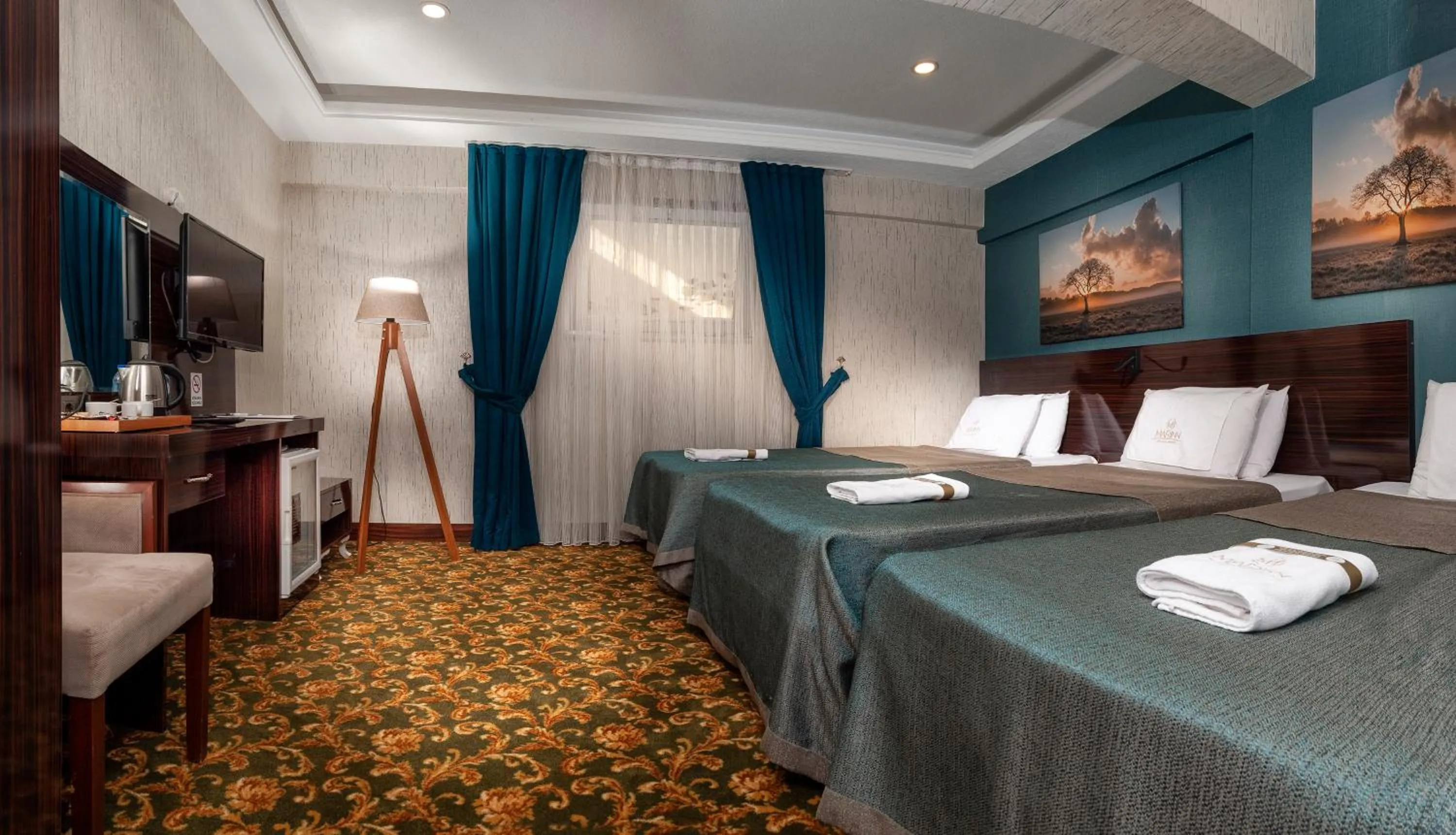 Bed in MARINN DELUXE HOTEL