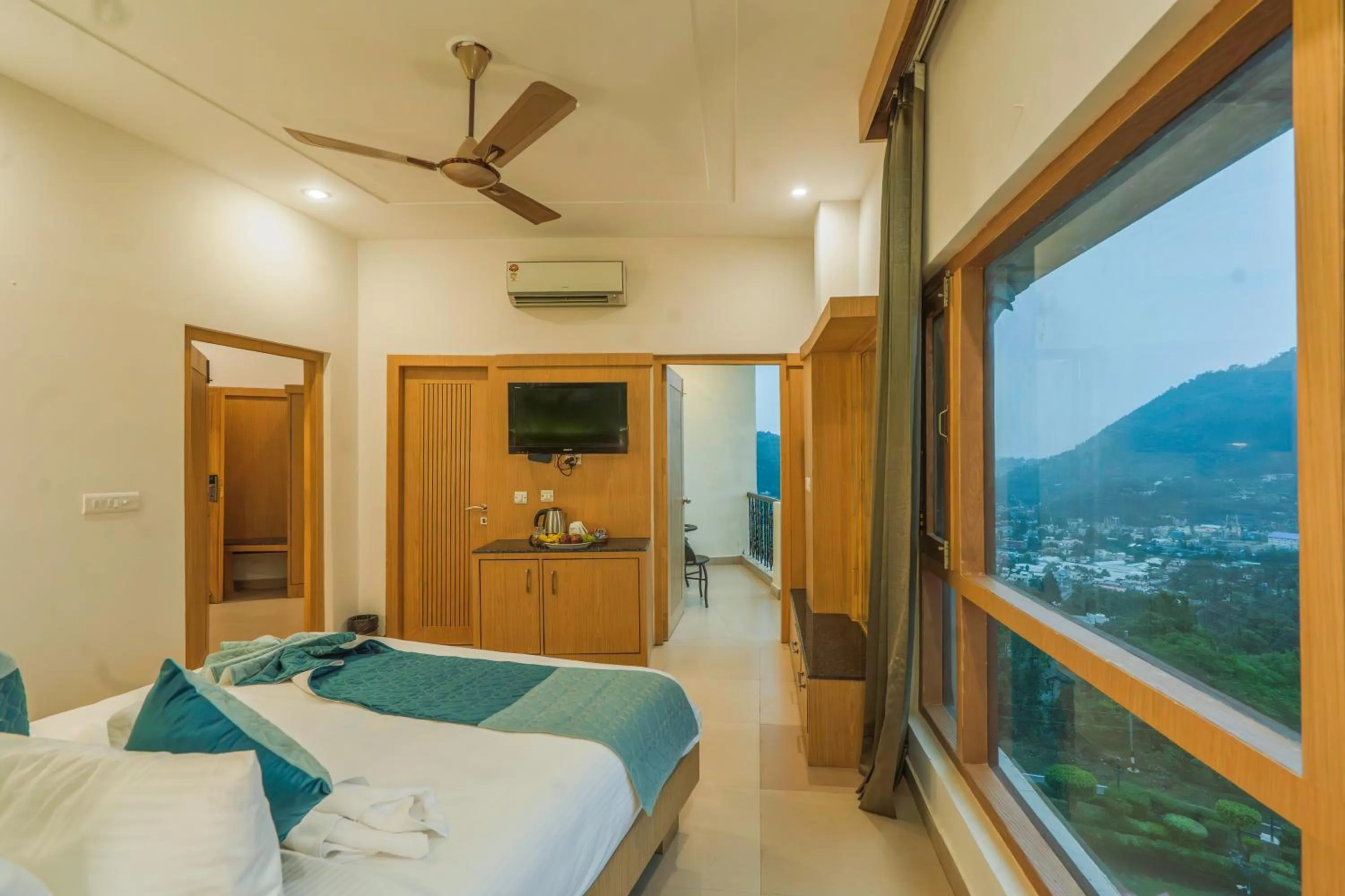 Bed in Excel Hotels and Resorts Bhimtal