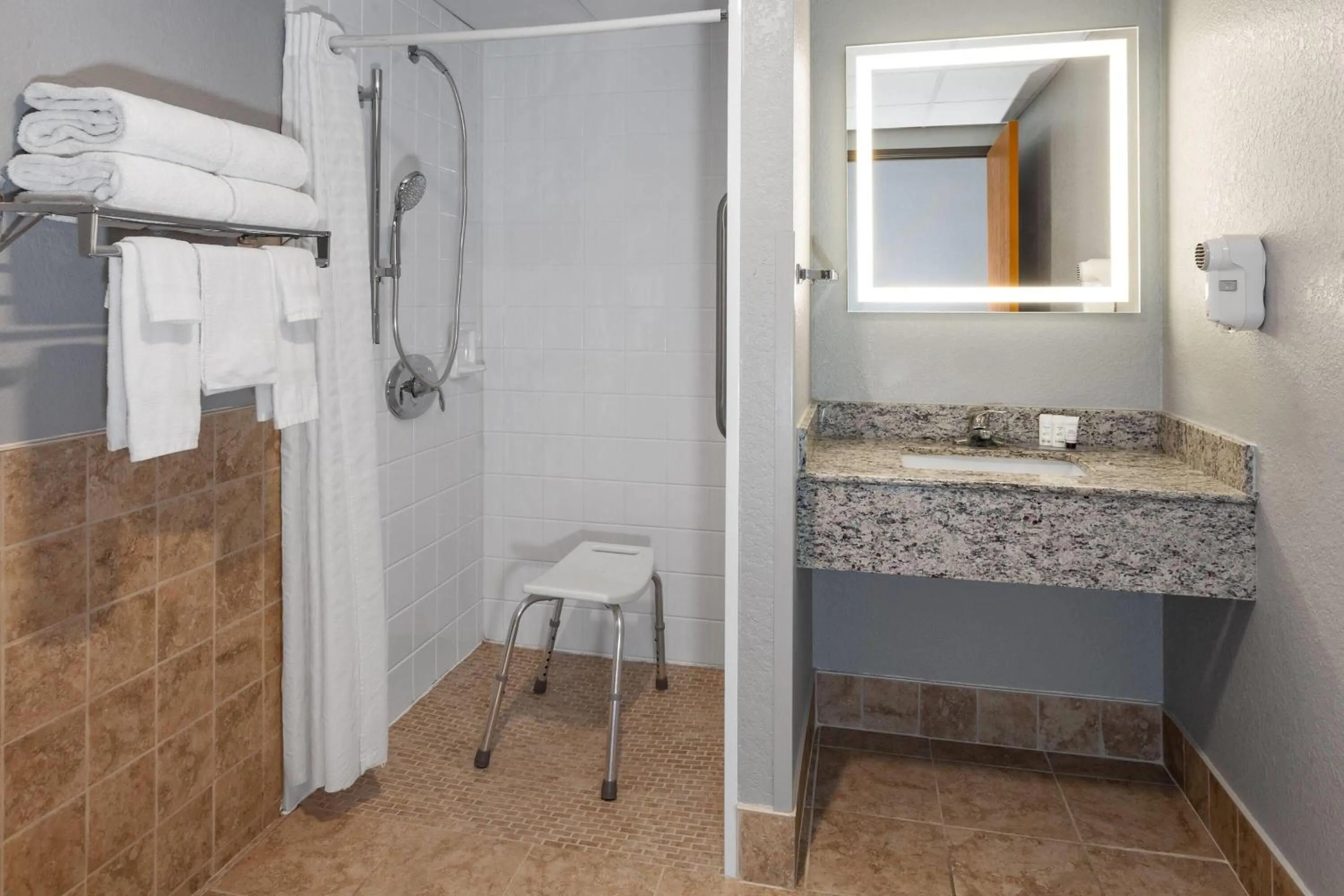 Shower in AmericInn by Wyndham Plymouth