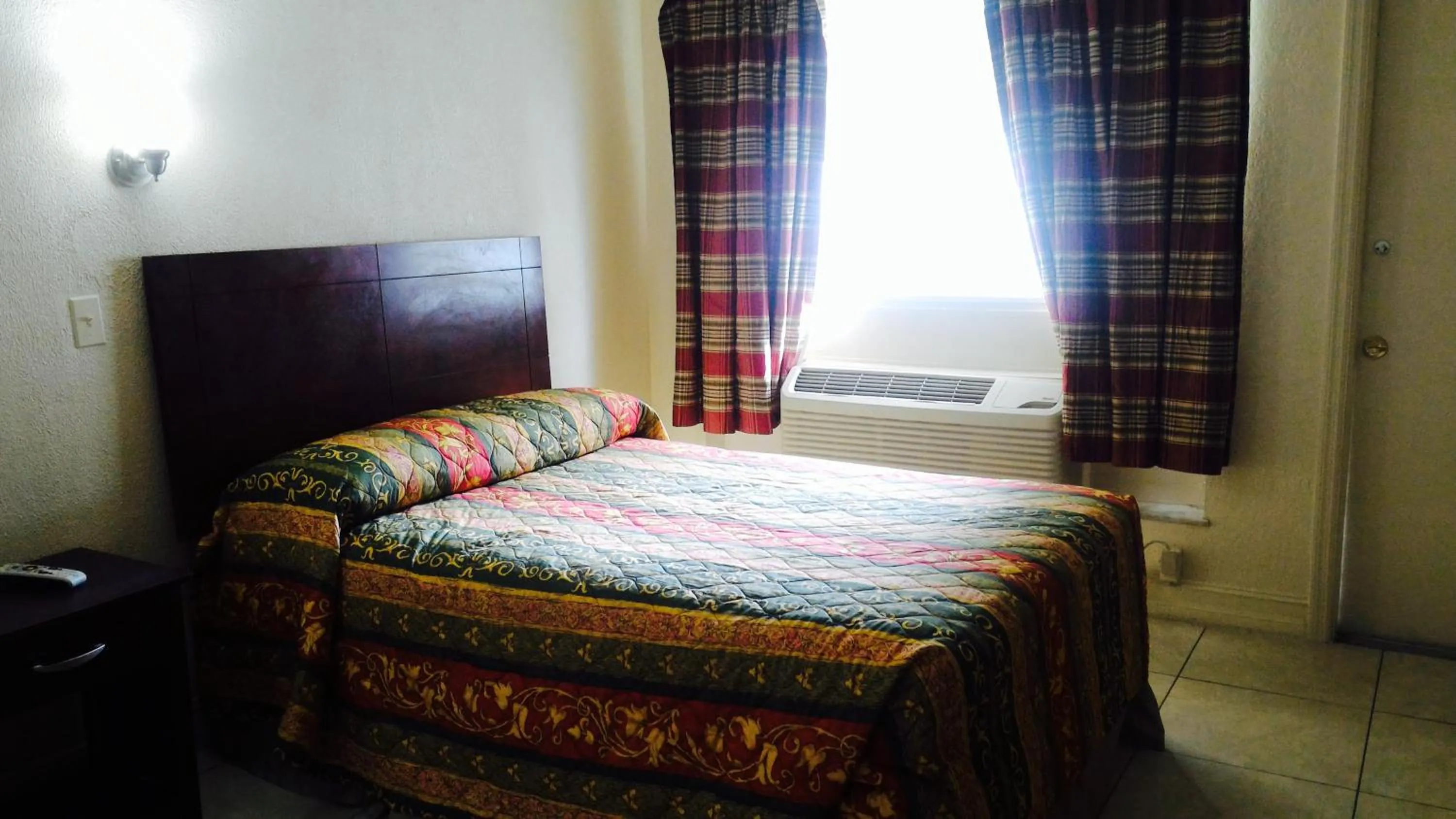 Bed in Sunset Inn- Fort Pierce, FL