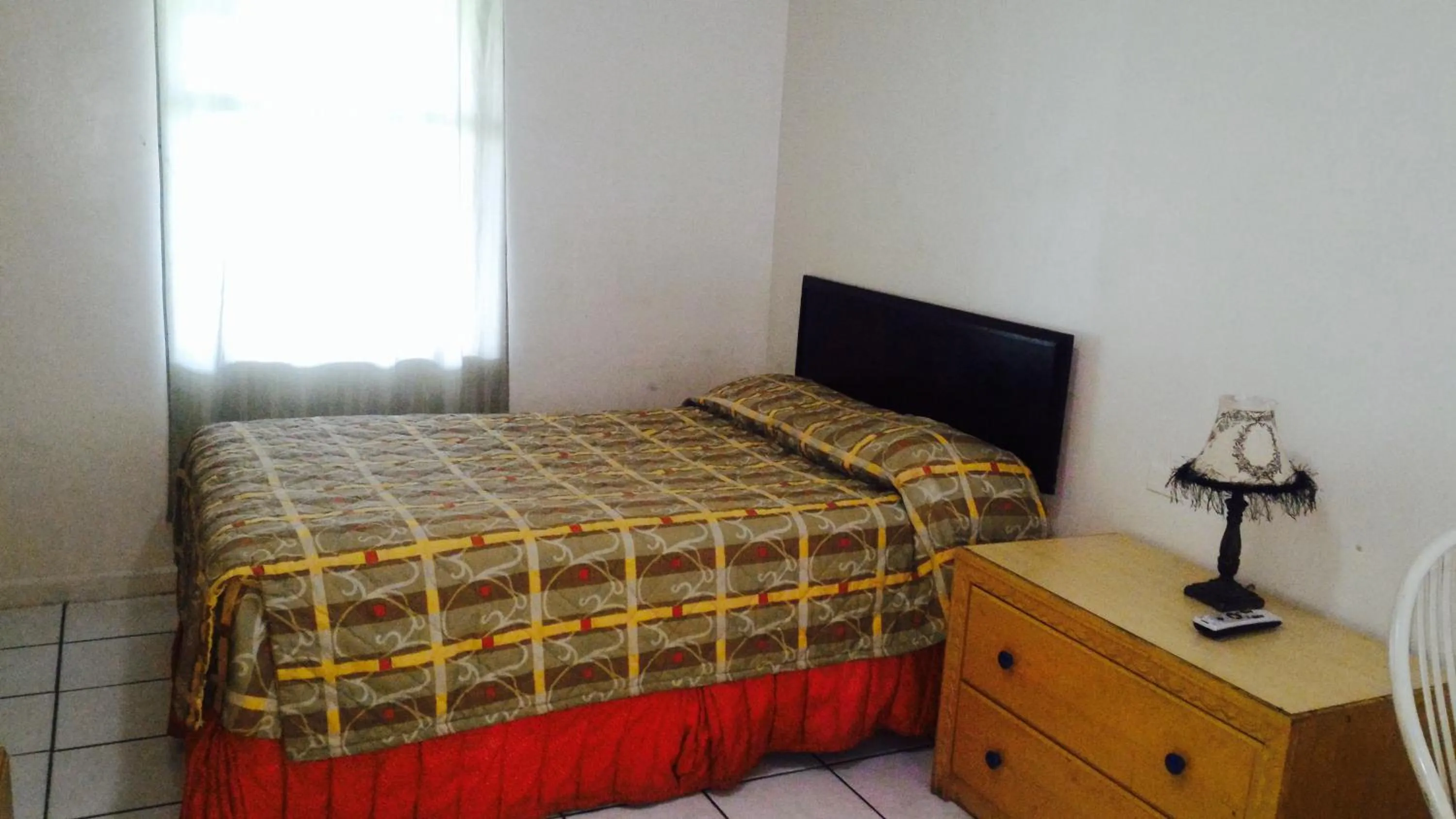 Bed in Sunset Inn- Fort Pierce, FL