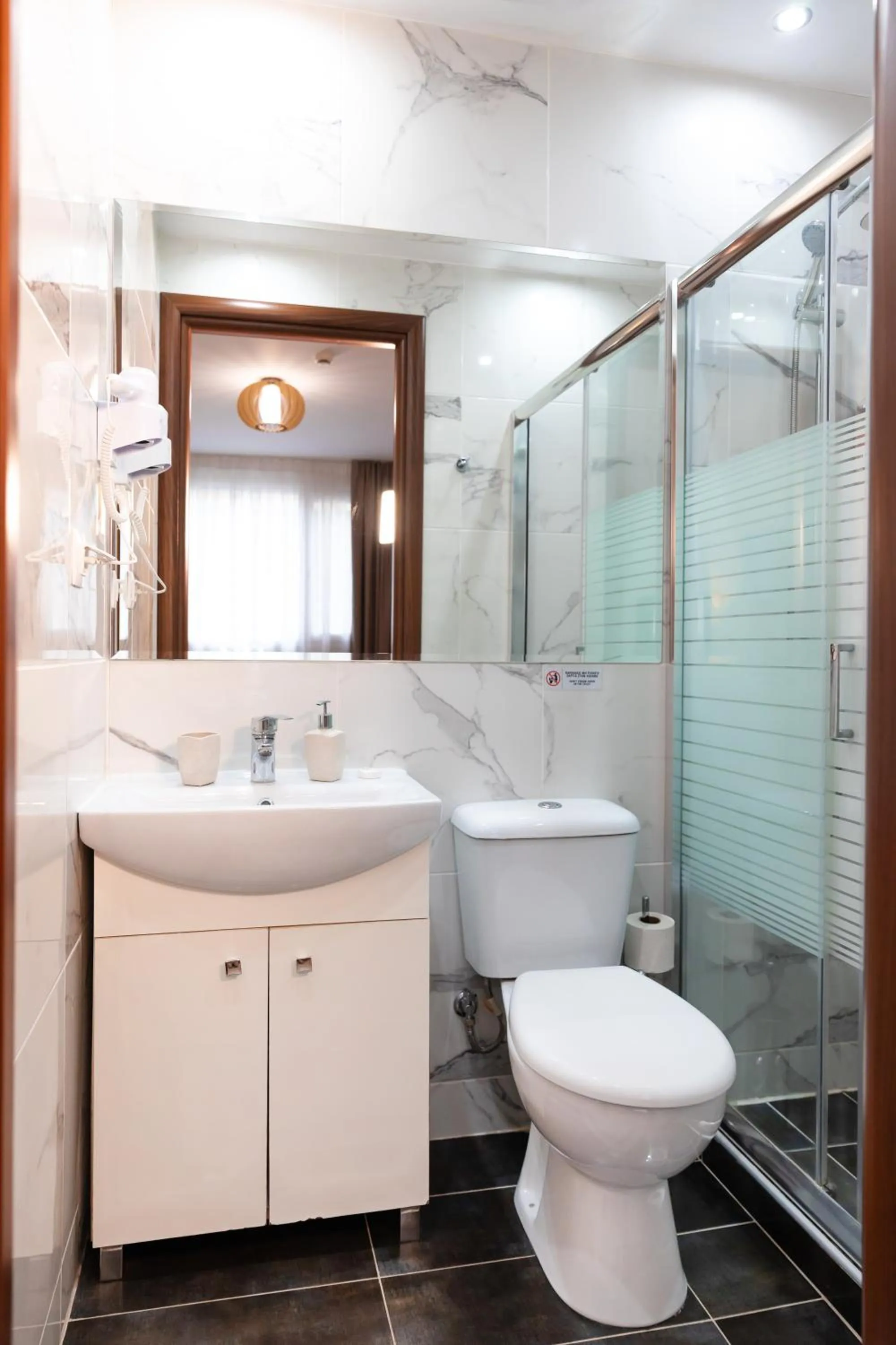 Shower in City Plaza Apartments & Rooms