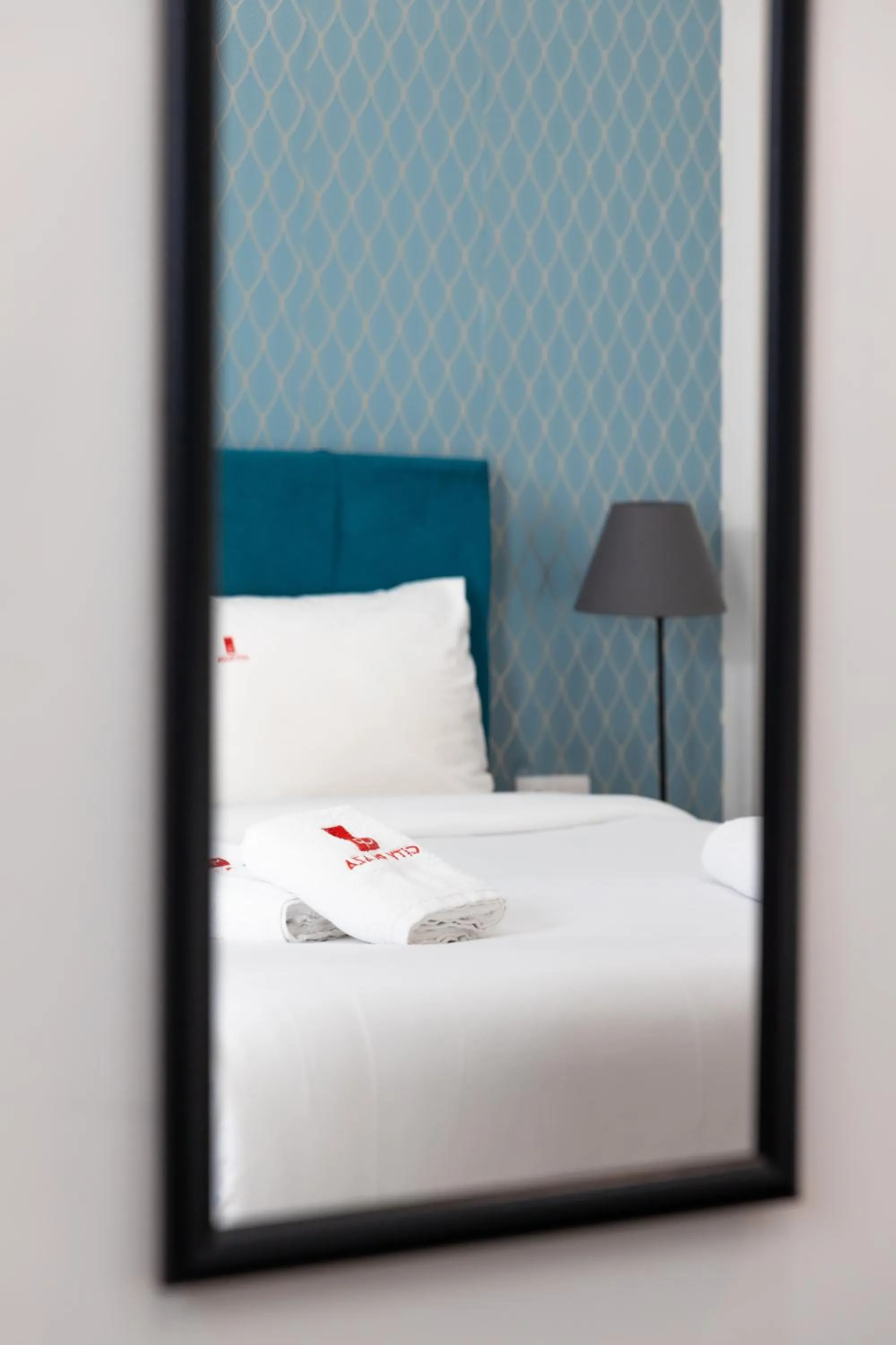 Bed in City Plaza Apartments & Rooms