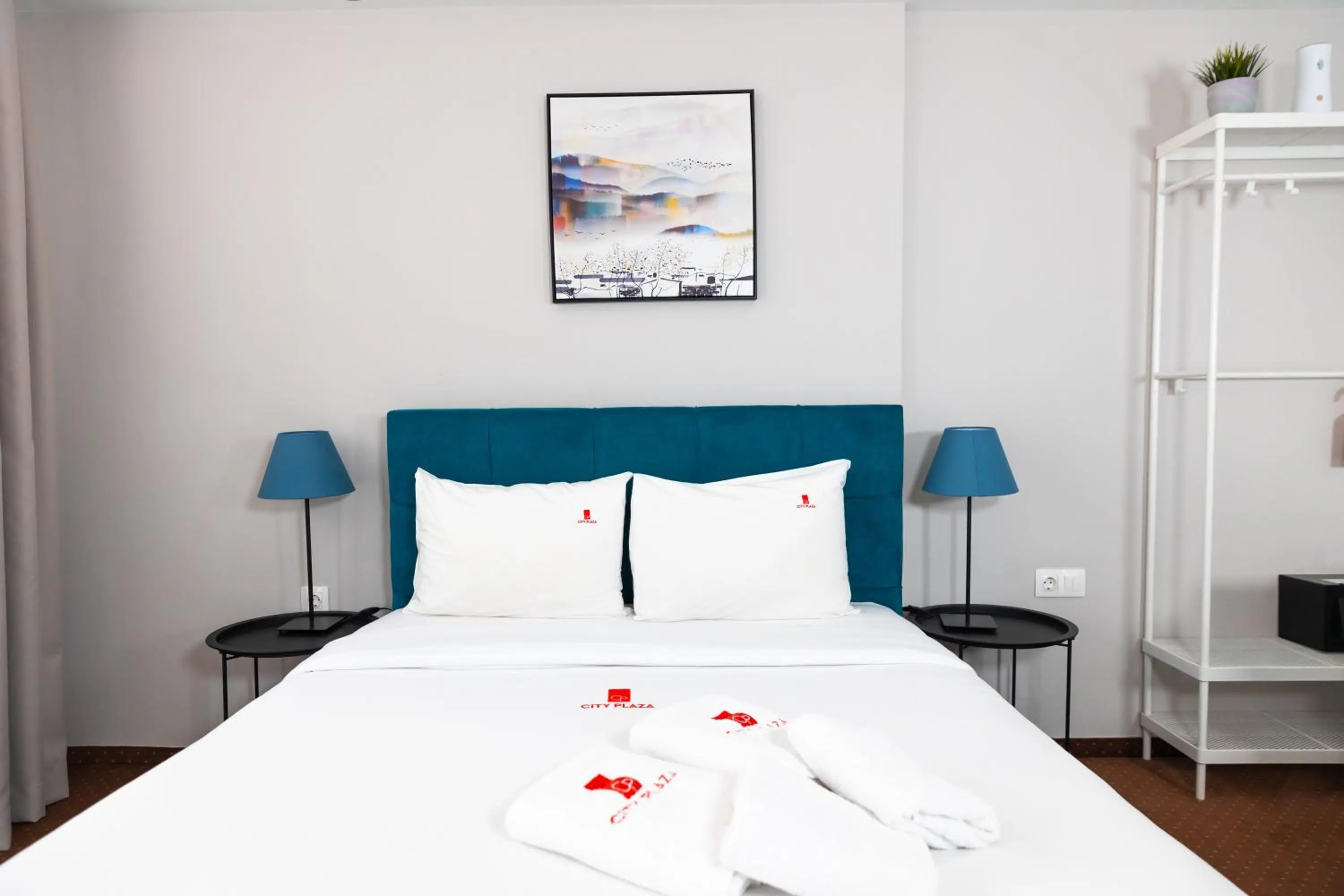 Bed in City Plaza Apartments & Rooms