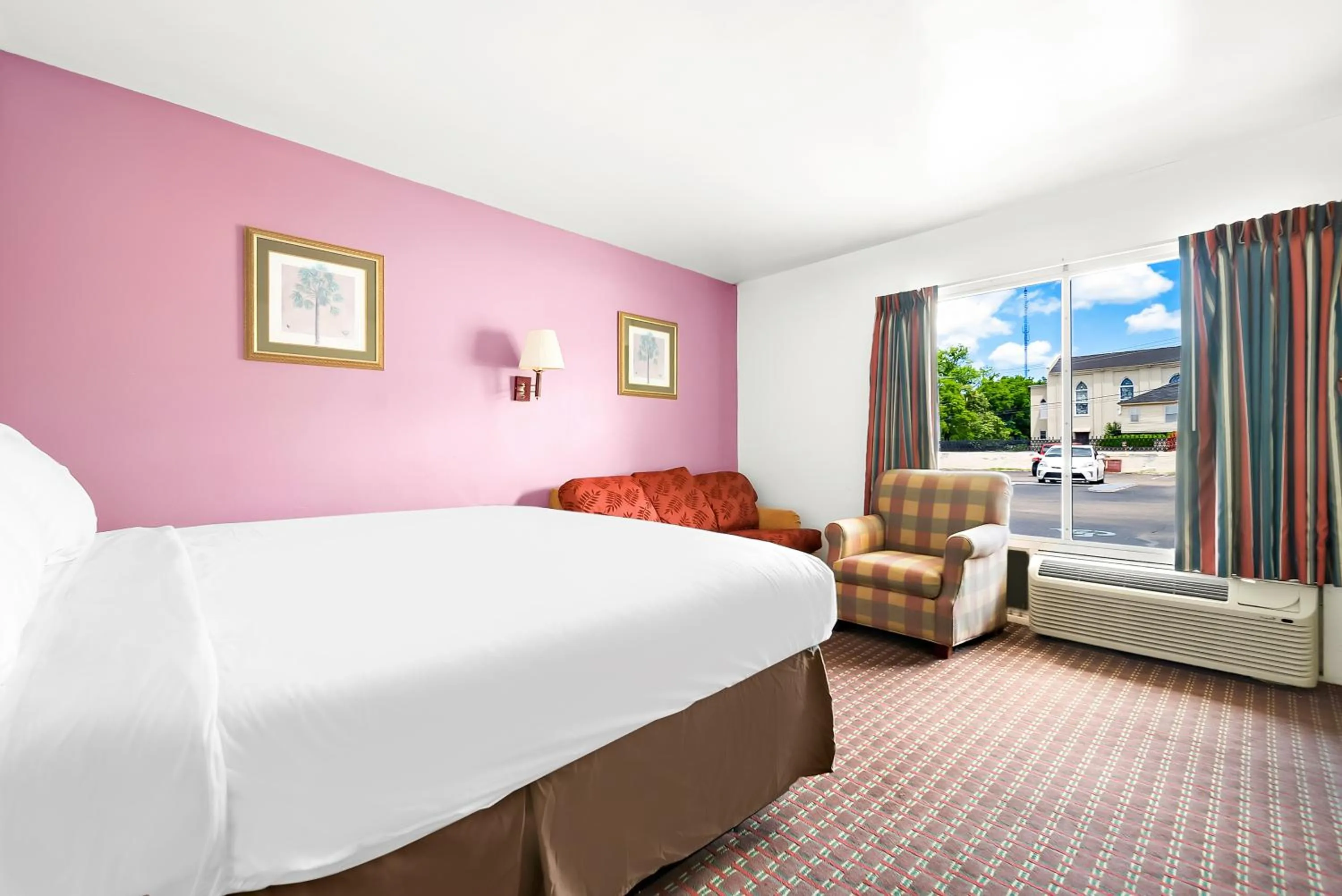 Bed in Capitol Inn and Suites