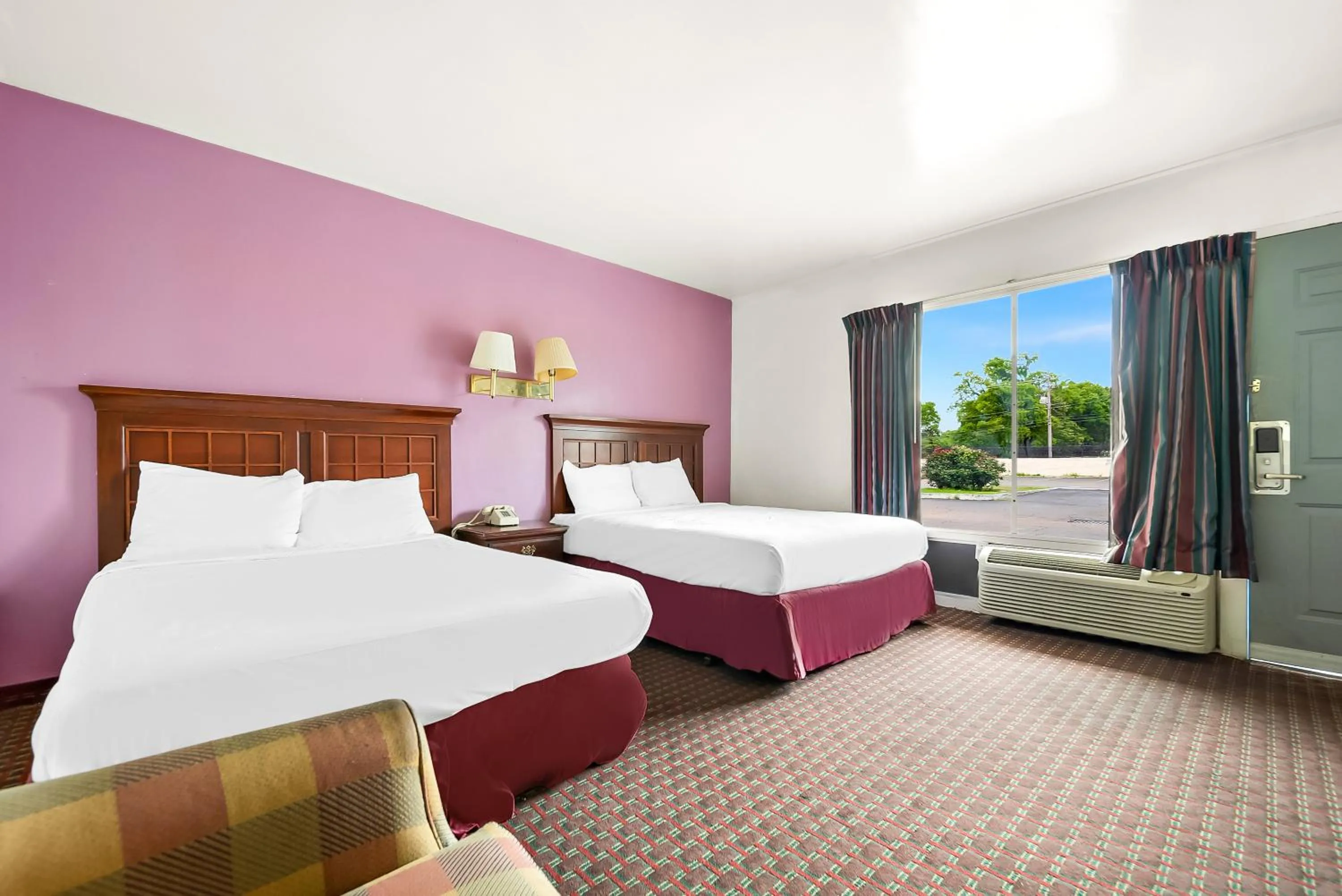 Bed in Capitol Inn and Suites