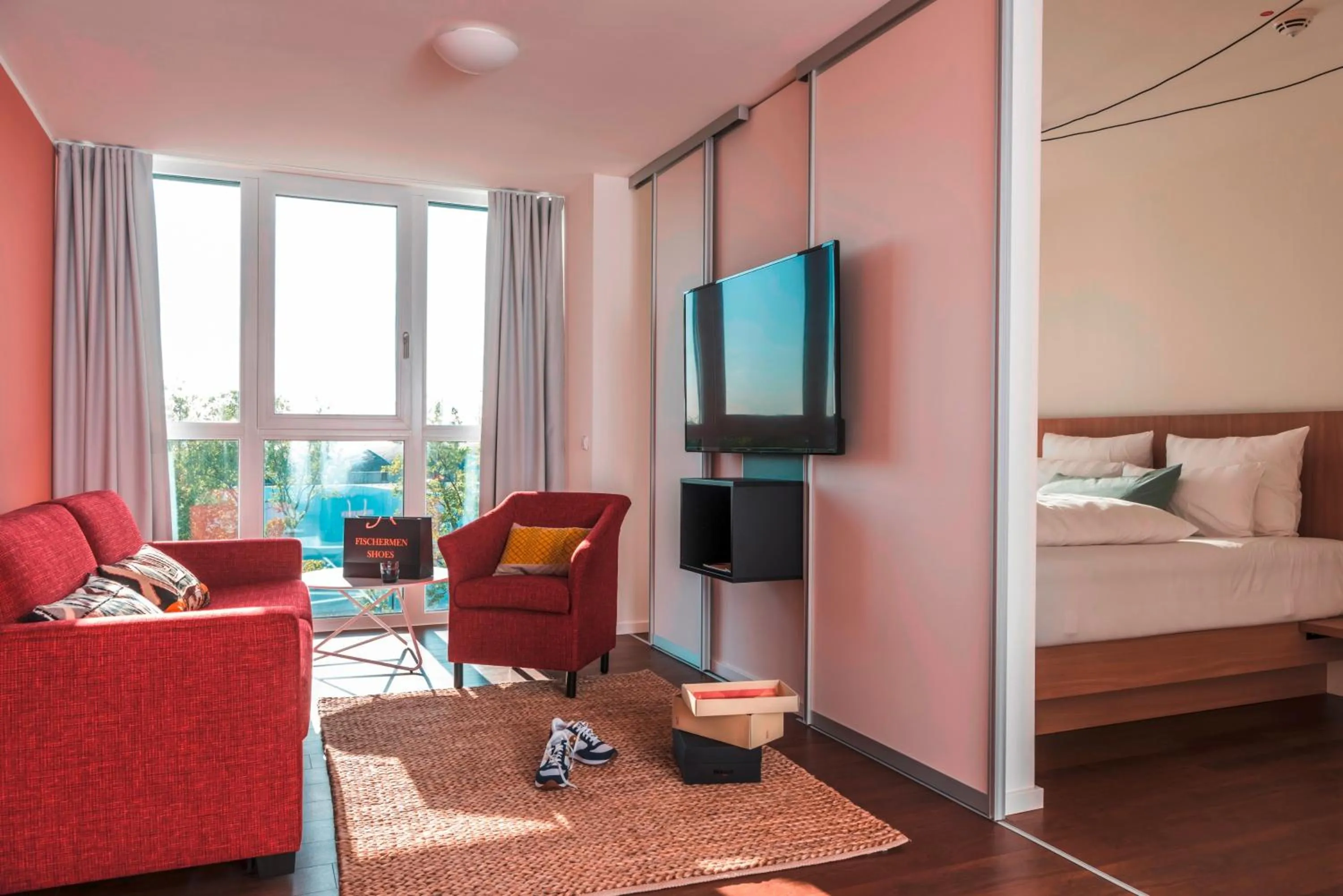 Seating area, Bed in Mintrops Concierge Hotel