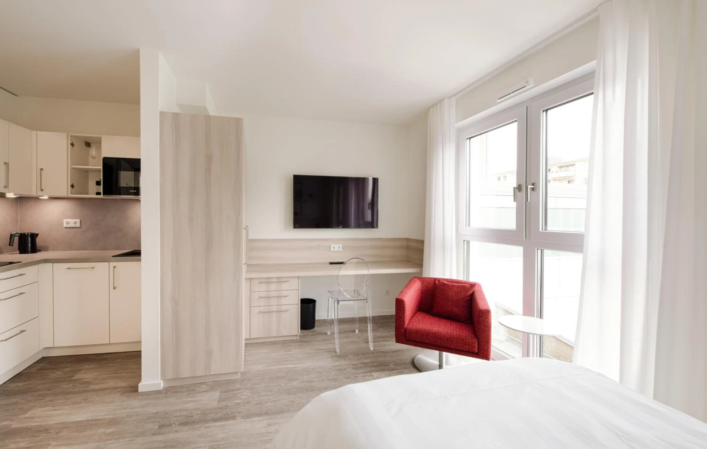 Kitchen or kitchenette, Bed in Mintrops Concierge Hotel