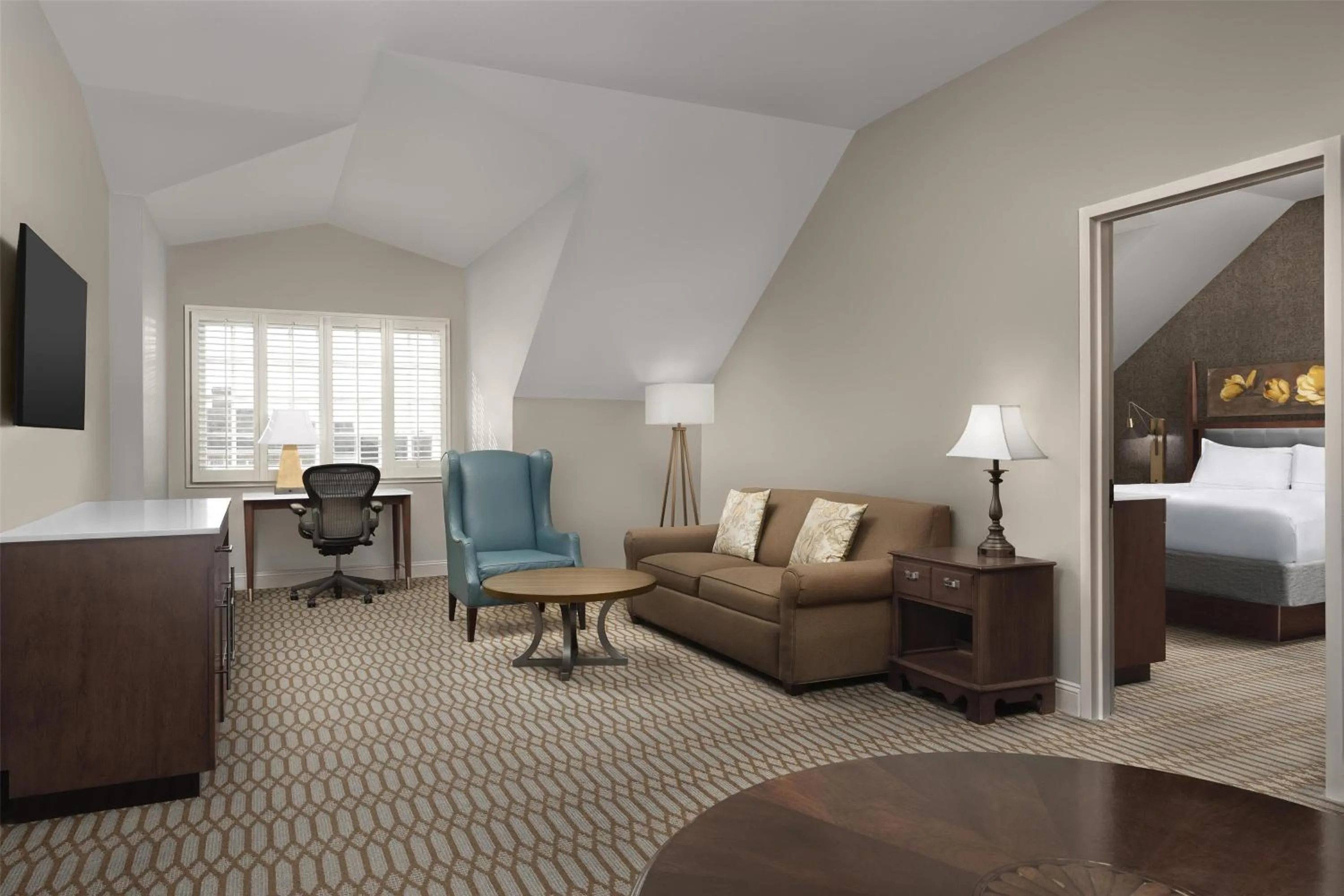 Living room, Bed in Virginia Crossings Hotel, Tapestry Collection by Hilton