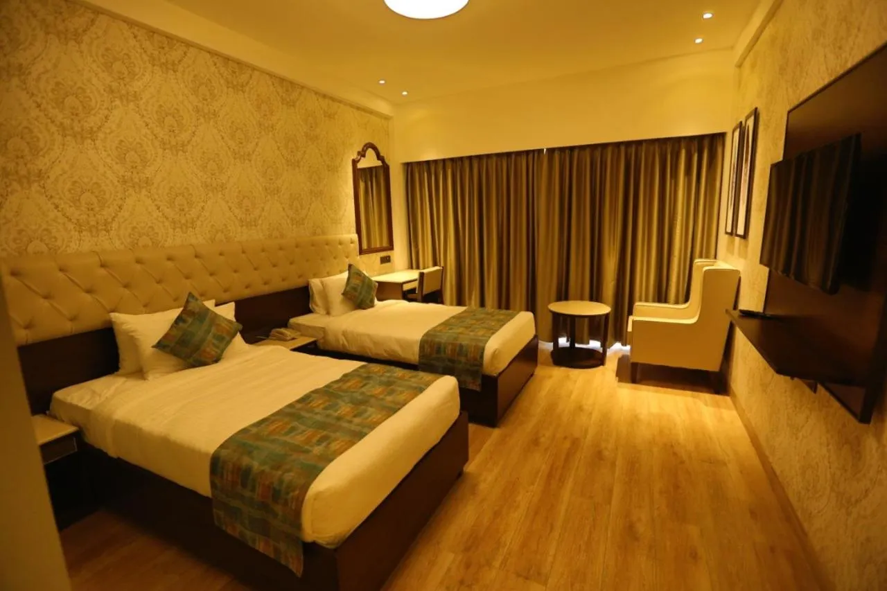 Communal lounge/ TV room, Bed in Enrise By Sayaji Rau Indore