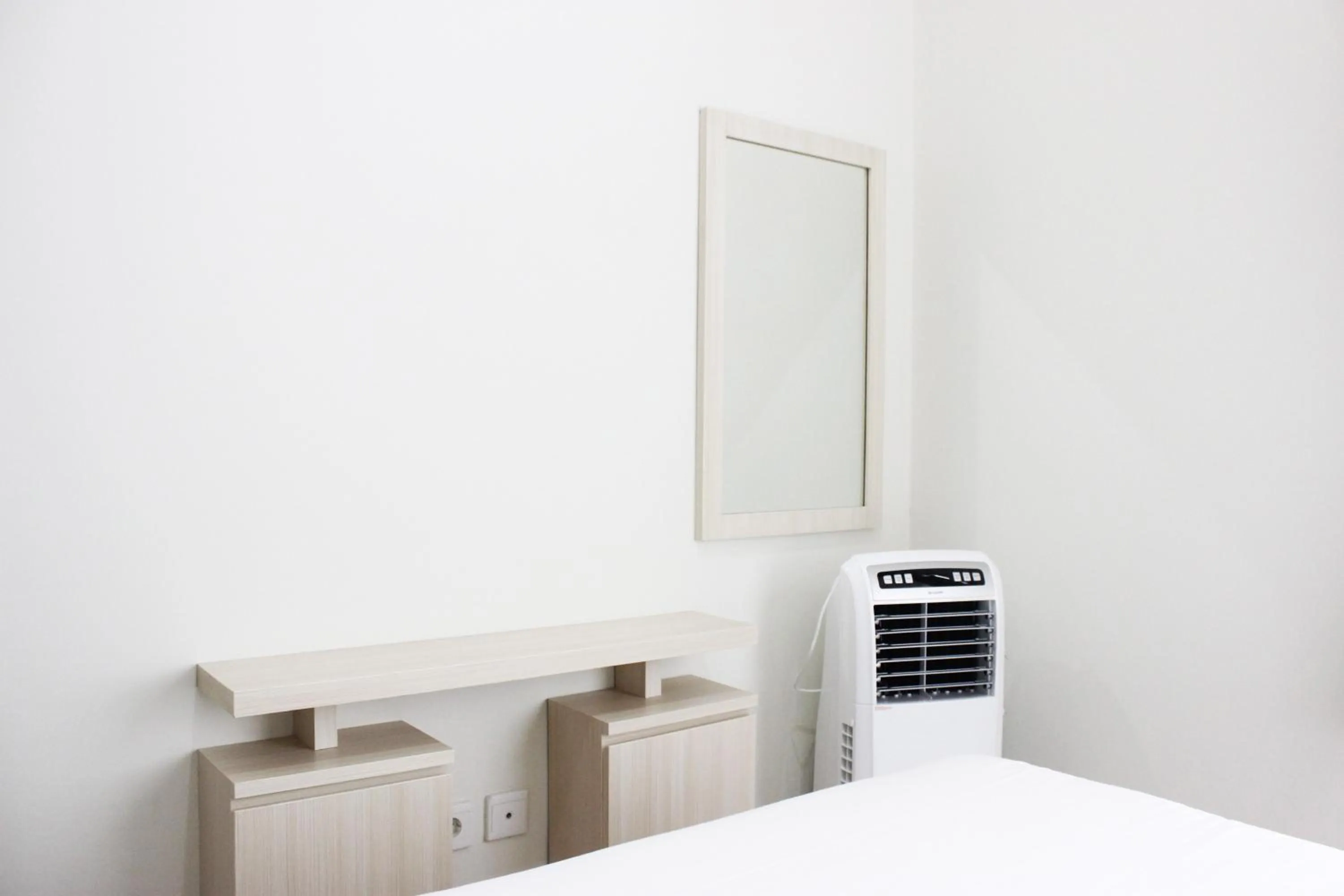 Bed in Cozy 2BR Apartment @ Newton Residence By Travelio