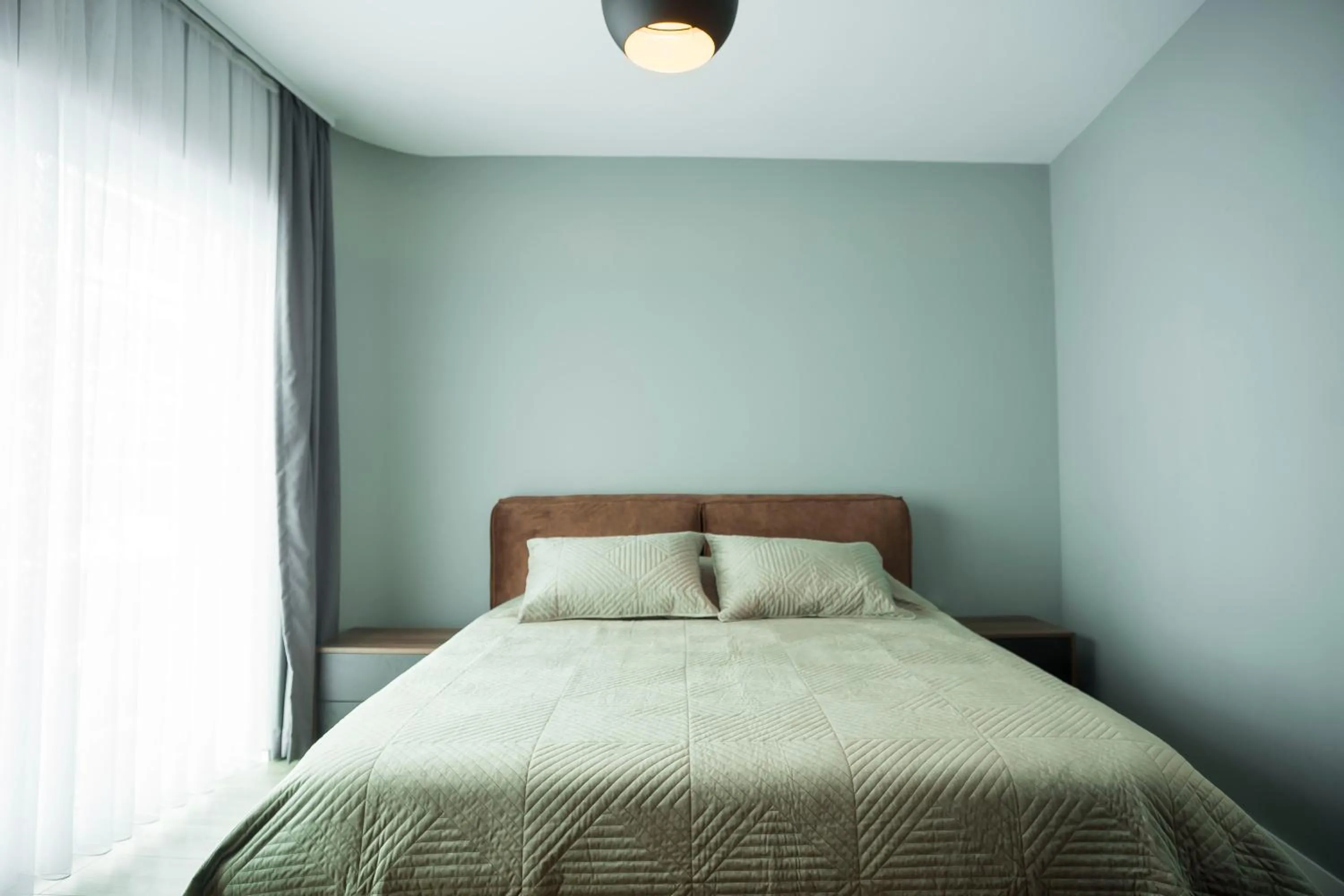 Bed in Lux Apartments