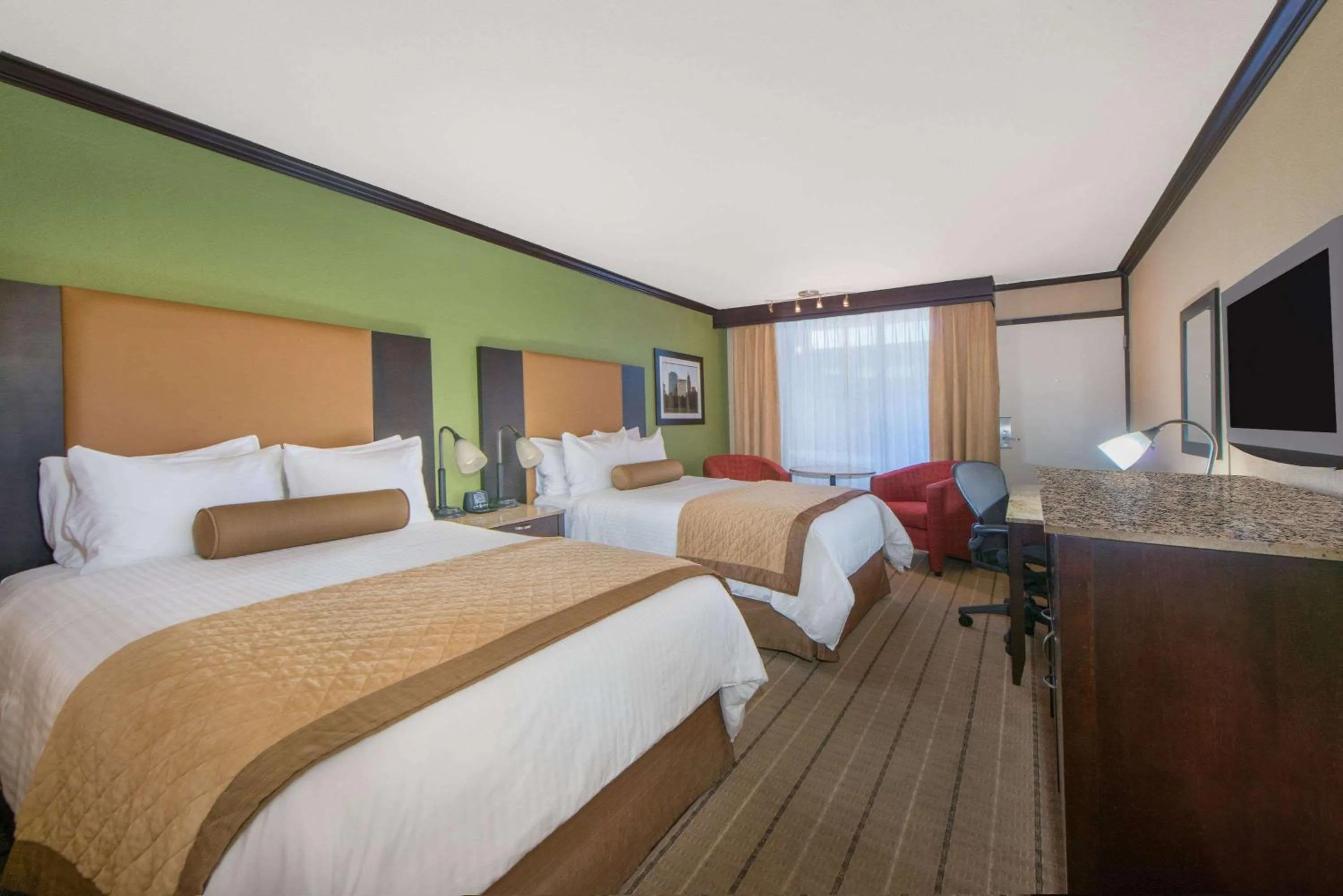 Photo of the whole room, Bed in Wyndham Garden Oklahoma City Resort & Conference Hotel Near Airport, Fairgrounds Paycom & I40